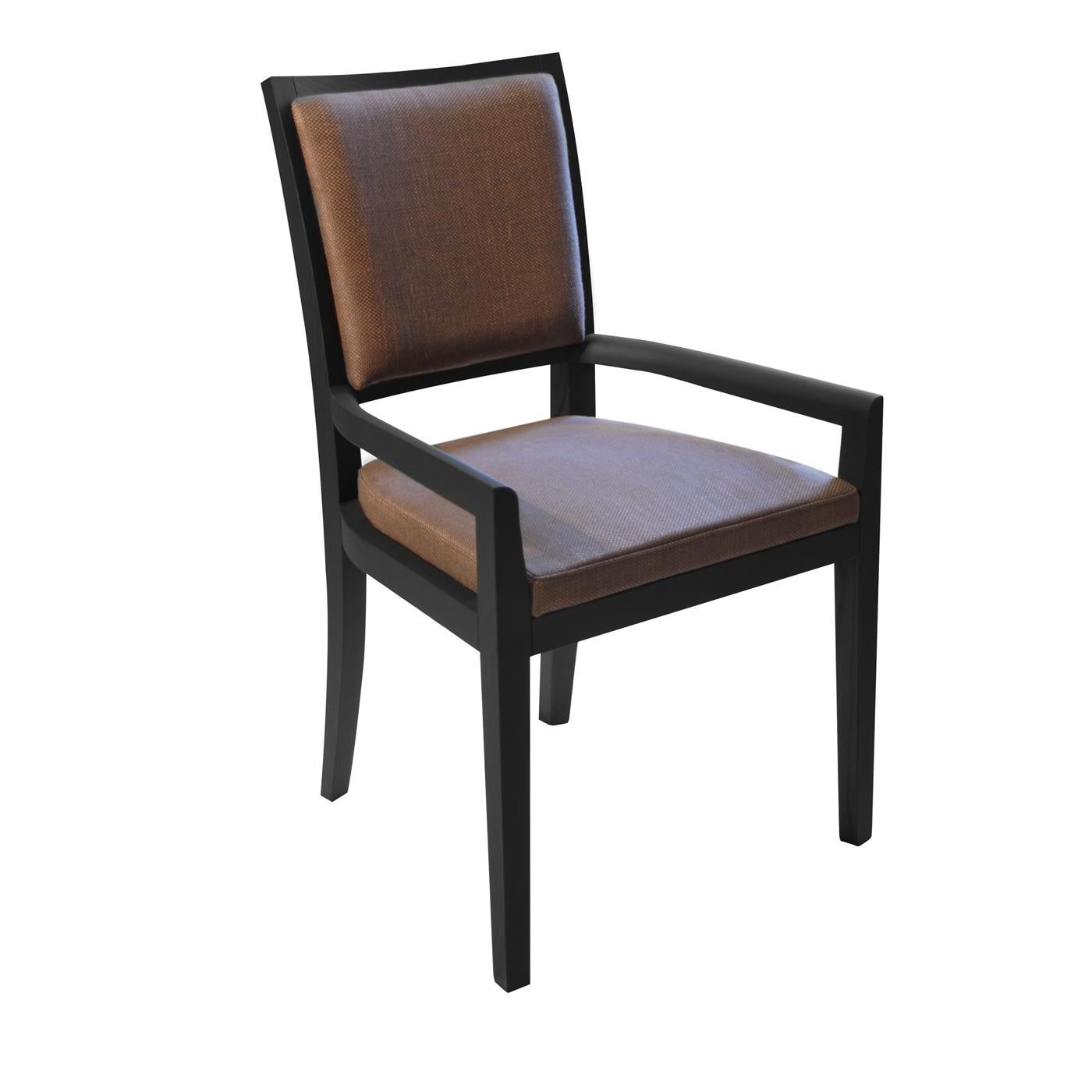 Bold and sleek, this chair with armrests is marked by a simple design and timeless elegance. Its clean structure is fashioned of stained solid ash and comprises sturdy legs and armrests. Seat and backrest are upholstered in high-quality anthracite