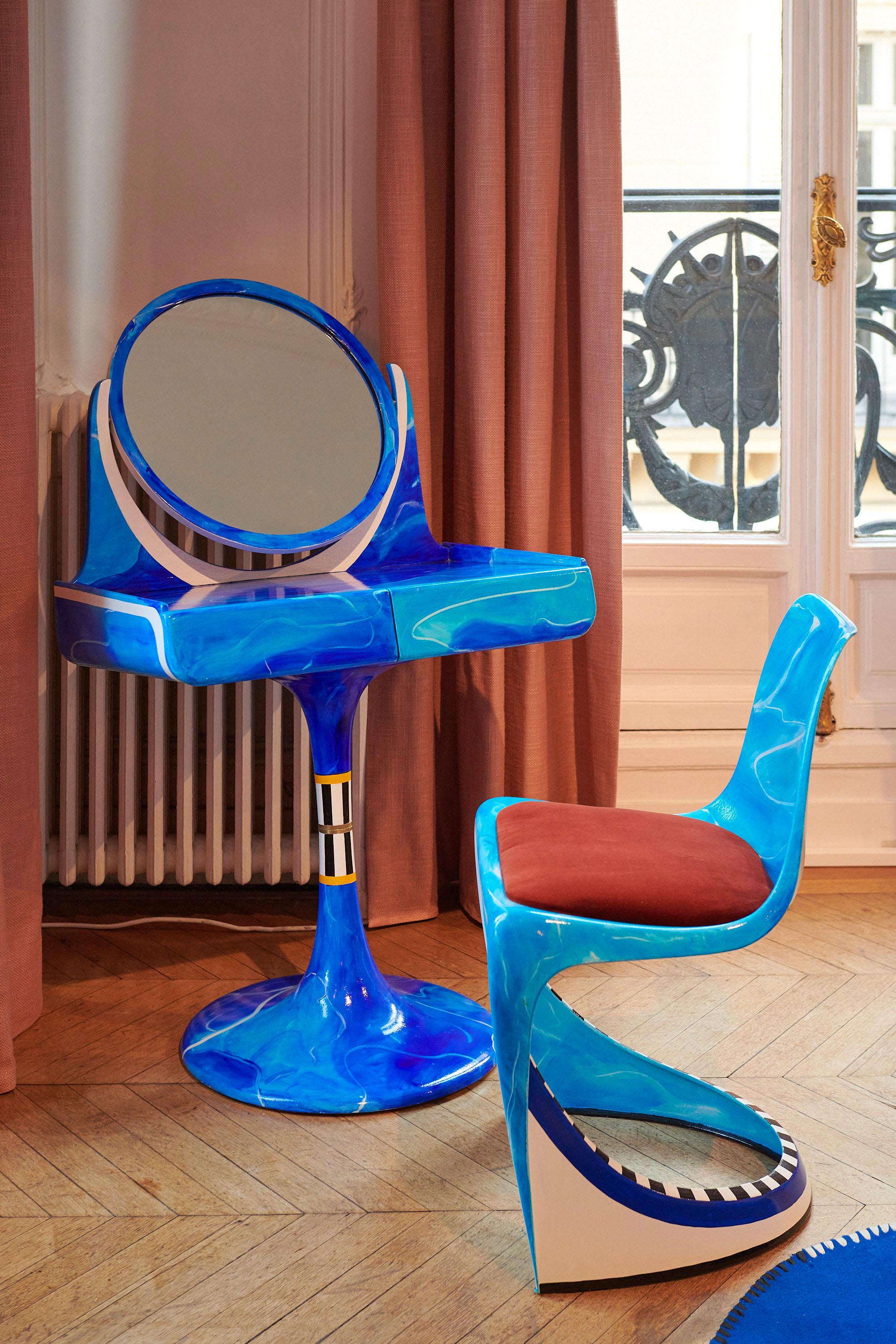 Tulip foot dressing table from the 60 ies, including two drawers and a rotating mirror. Its inclination give it a surrealist look. 

This dressing table was custom made, probably in the 70's
The water takes over the design, this piece is entirely