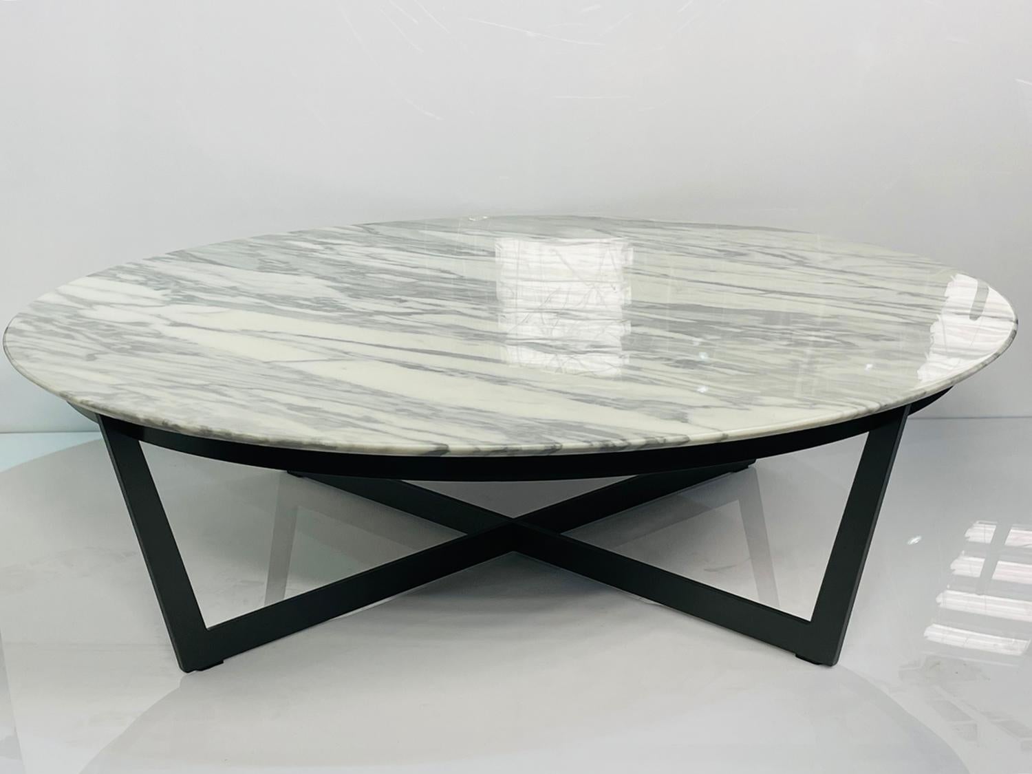 Beautiful coffee table designed and manufactured by CAMERICH and part of the ELEMENT collection.

The table base is made out of steel with a black finish and the top is Carrara marble.

Measurements:
47.25 inches in diameter x 13.75 inches high.