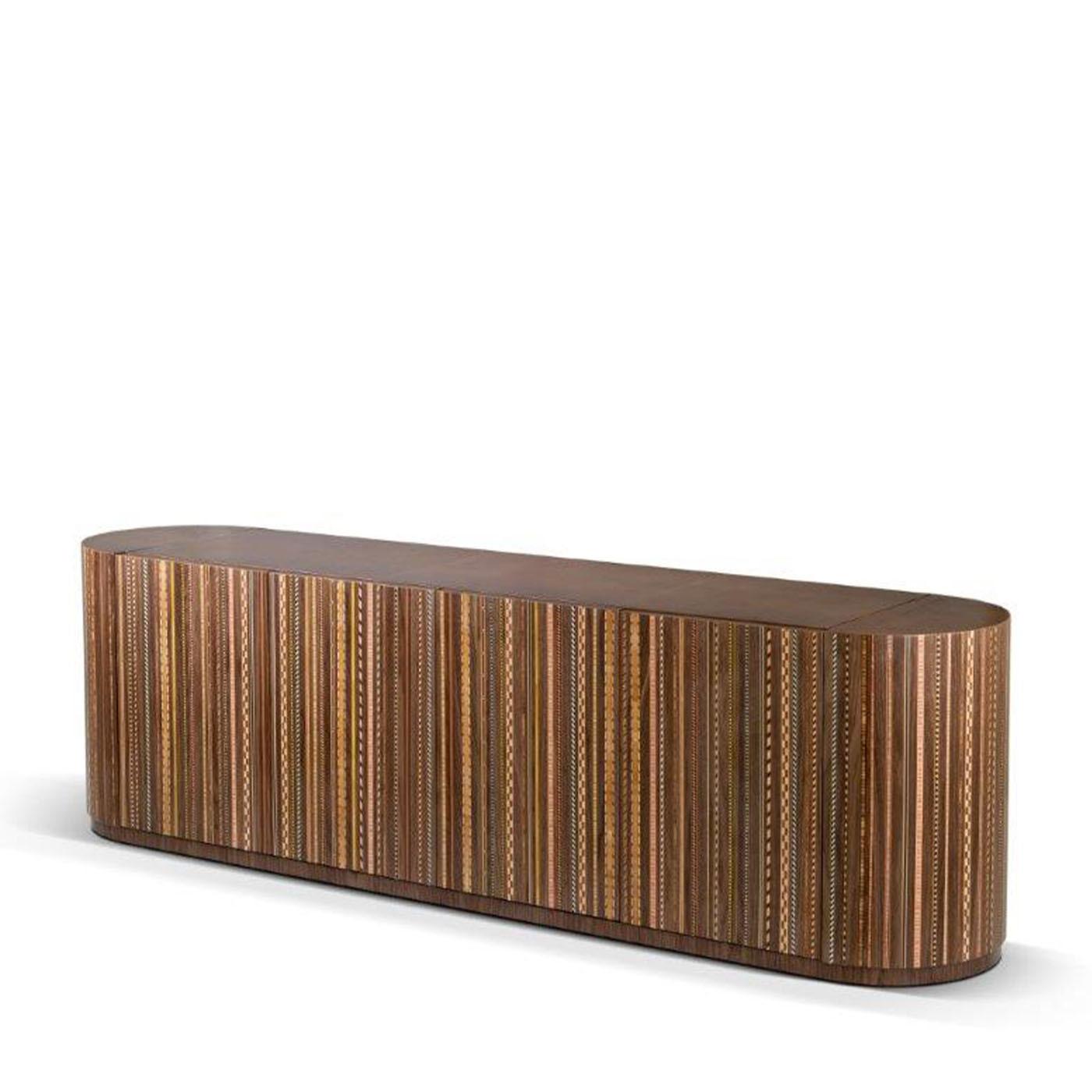 Rigor and eccentricity coexist in unexpected harmony in this exclusive walnut sideboard. Characterized by a vertical progression enhancing the general visual impact, a triumph of multicolor wooden inlays demands attention to an otherwise rigorous