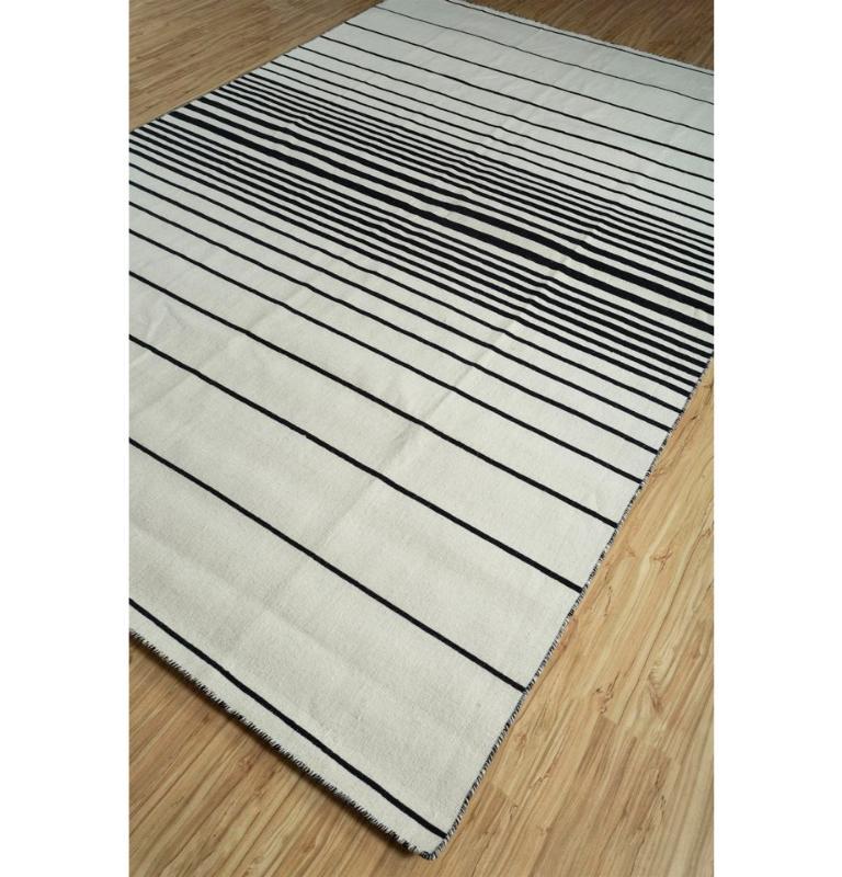 Infuse your space with modern elegance through our Flat Weave Rug, a masterpiece in 100% Wool Yarn. Embracing a contemporary twist on traditional geometric patterns, this handmade rug dances with vibrant hues against a pristine white backdrop. The