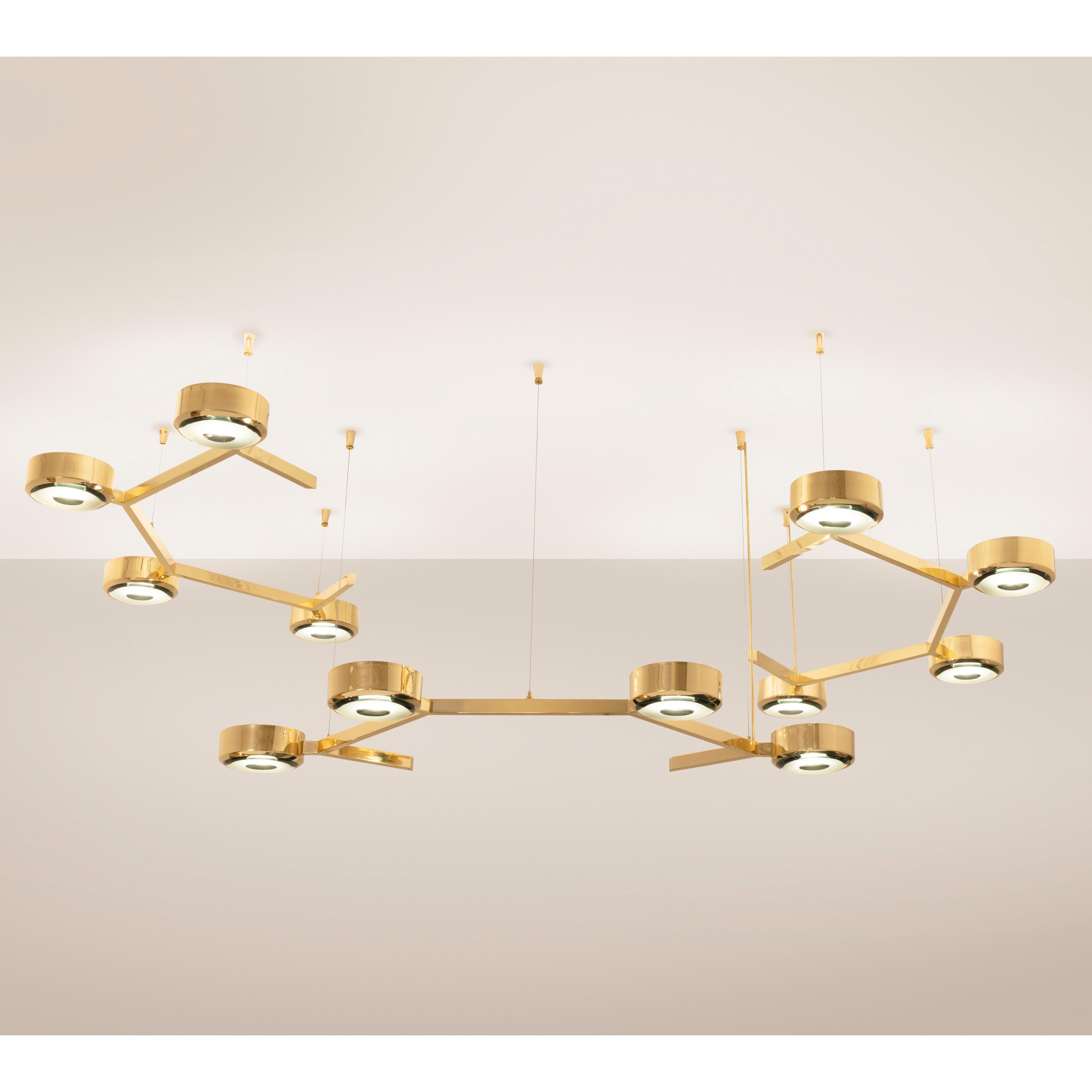 The Elemento by form A is a modular ceiling fixture composed of suspended “C” shaped elements with four glass shades. Shown as a staggered composition of three elements in polished brass with our carved glass made in Milan.

Customization Options: