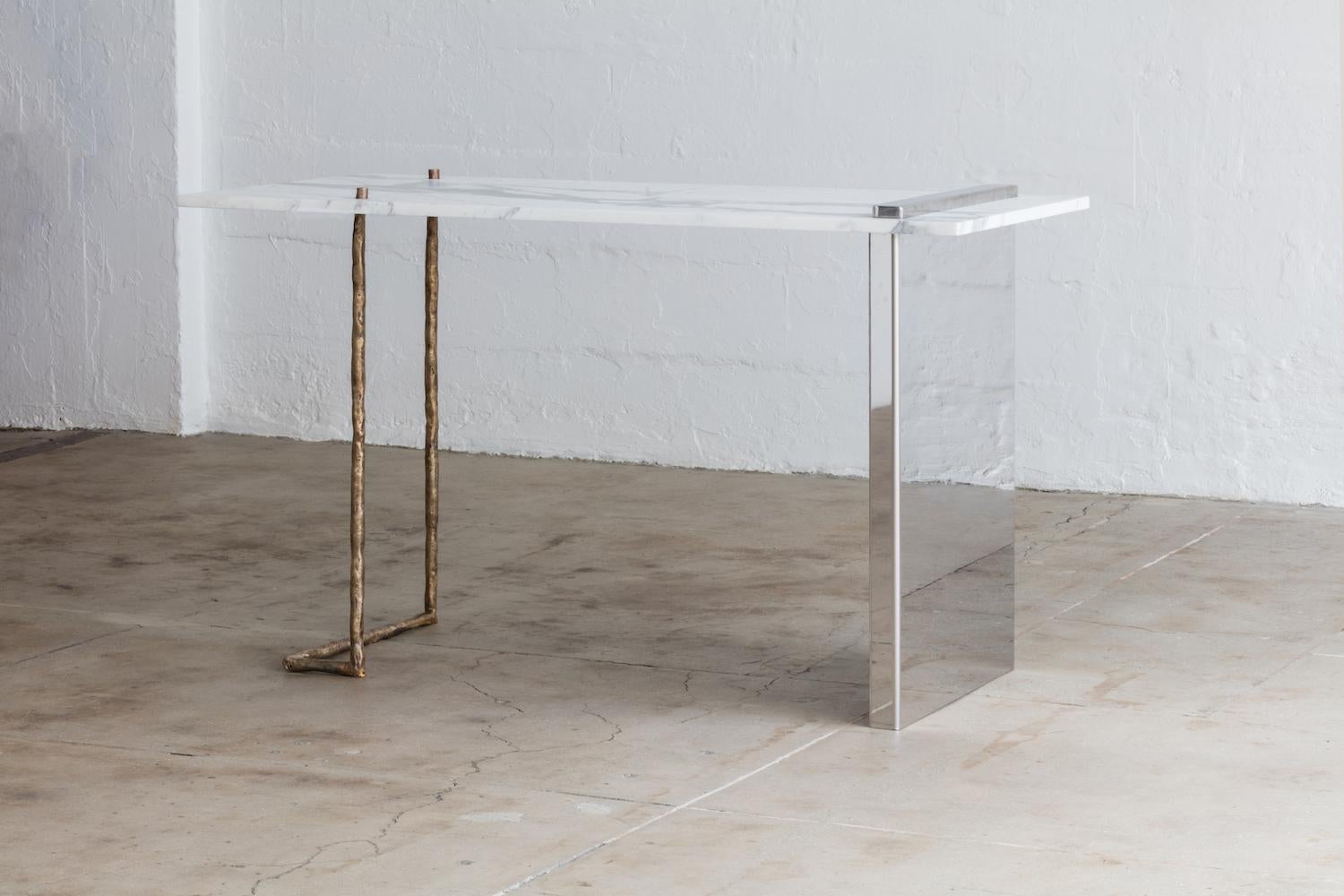 Measurements
24 W x 52 L x 30 H inches

Material Specifications
Top: Marble, wood, stone
Legs: Cast bronze, stainless steel

Notes
Finishes and dimensions may be customized. Please inquire for any custom orders.
Prices may vary depending on
