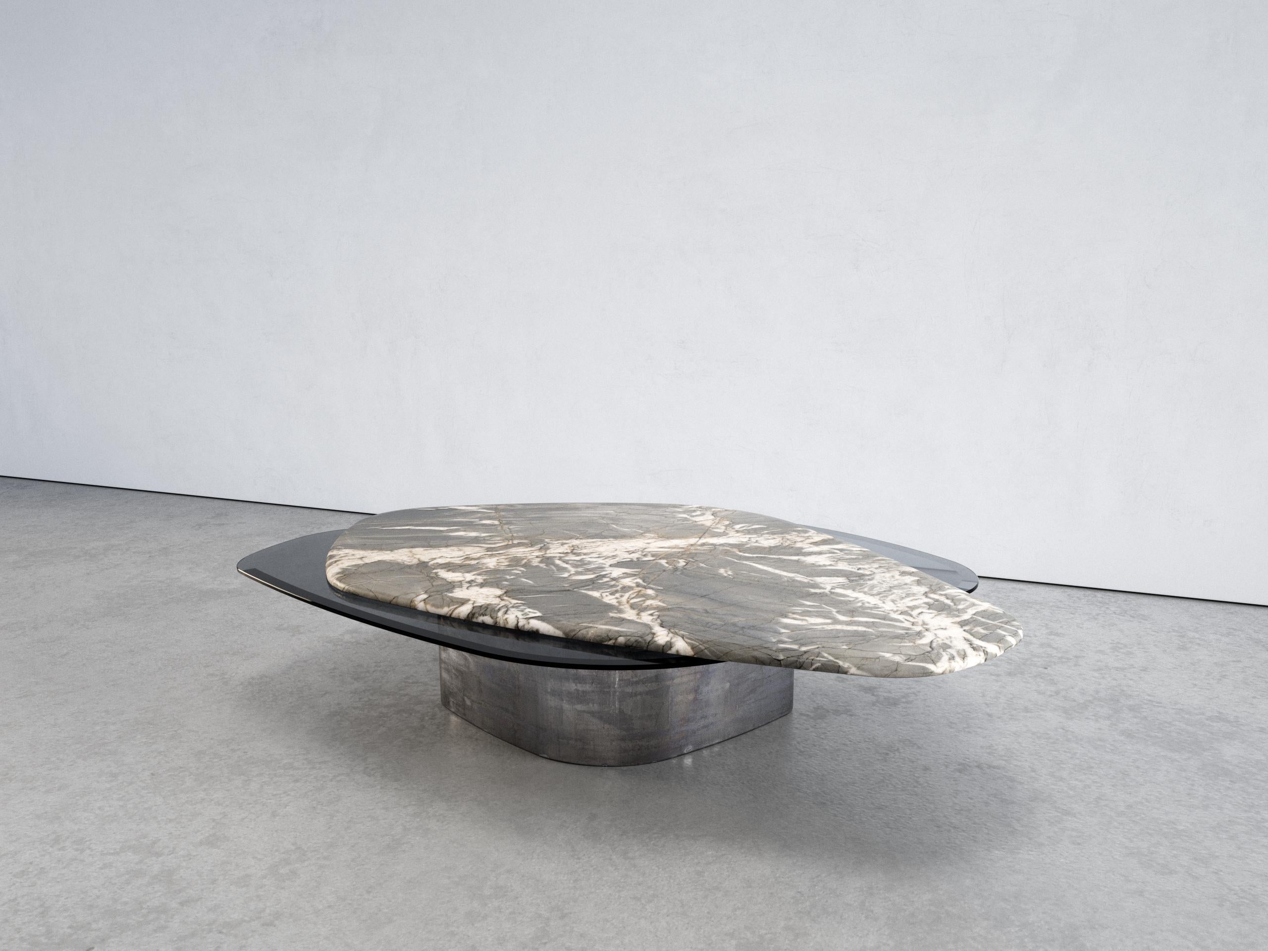 The elements VI coffee table by Grzegorz Majka
Edition 1 of 1
Dimensions: 54.3 x 41.3 x 13 in
Materials: marble, solid stainless steel plate in brushed finish

The Elements III is one of a kind and one of the series of various coffee tables