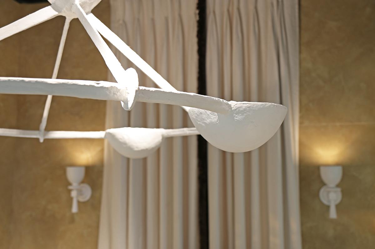 Sculptural ceiling light in metal and painted in a white plaster finish.

Handcrafted product. Surface finish and colour will vary in each piece. Colour cannot be truly represented on screen.

Available to order with international