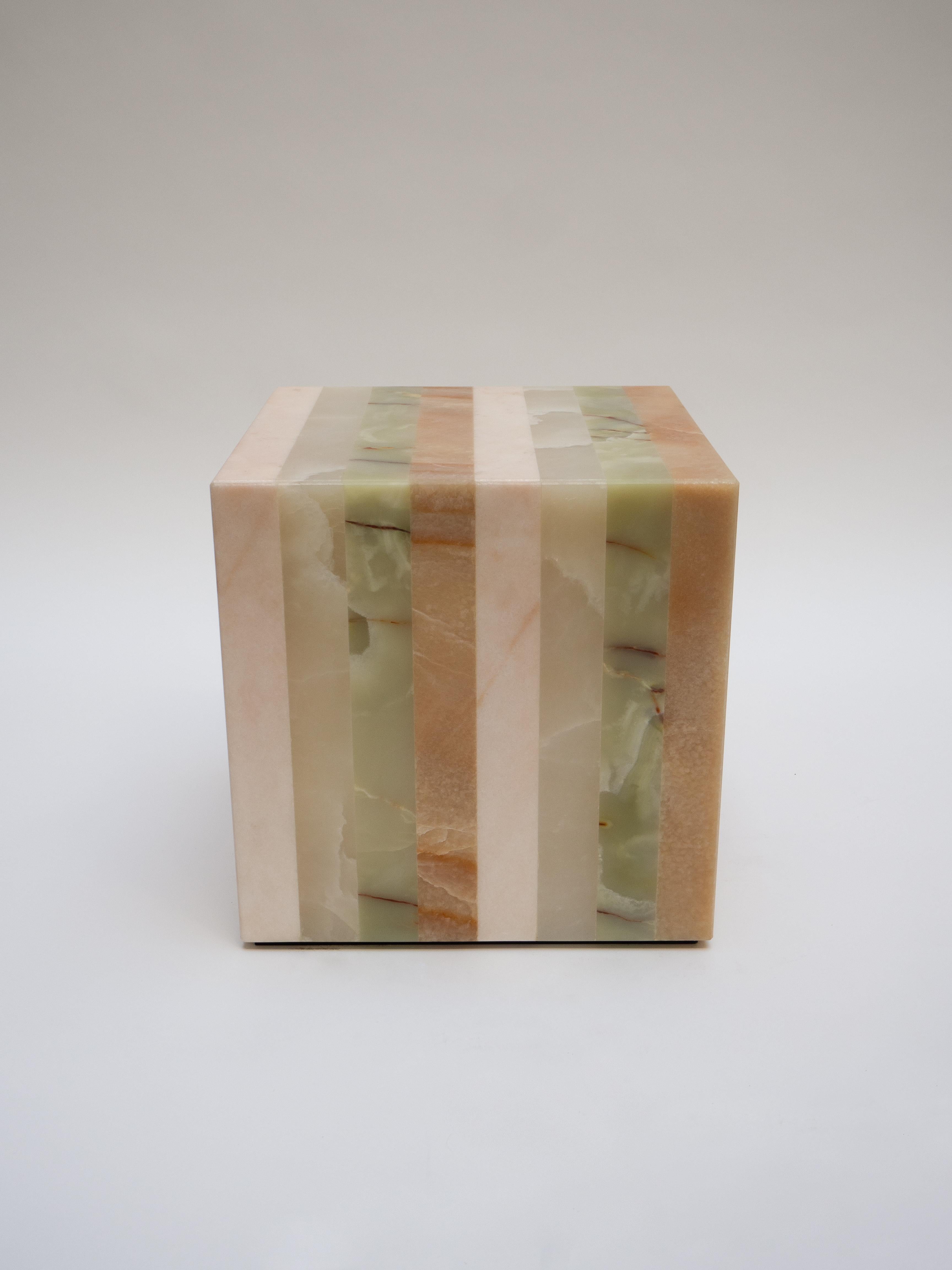 Elena Cube Side Table by Studio Gaia Paris
Dimensions: W 40 x D 40 x H 40 cm
Materials: Amber, Green, White and Pink Onyx


The Elena cube in striped onyx is a refined piece of furniture that will bring pep and color to any interior. Made from