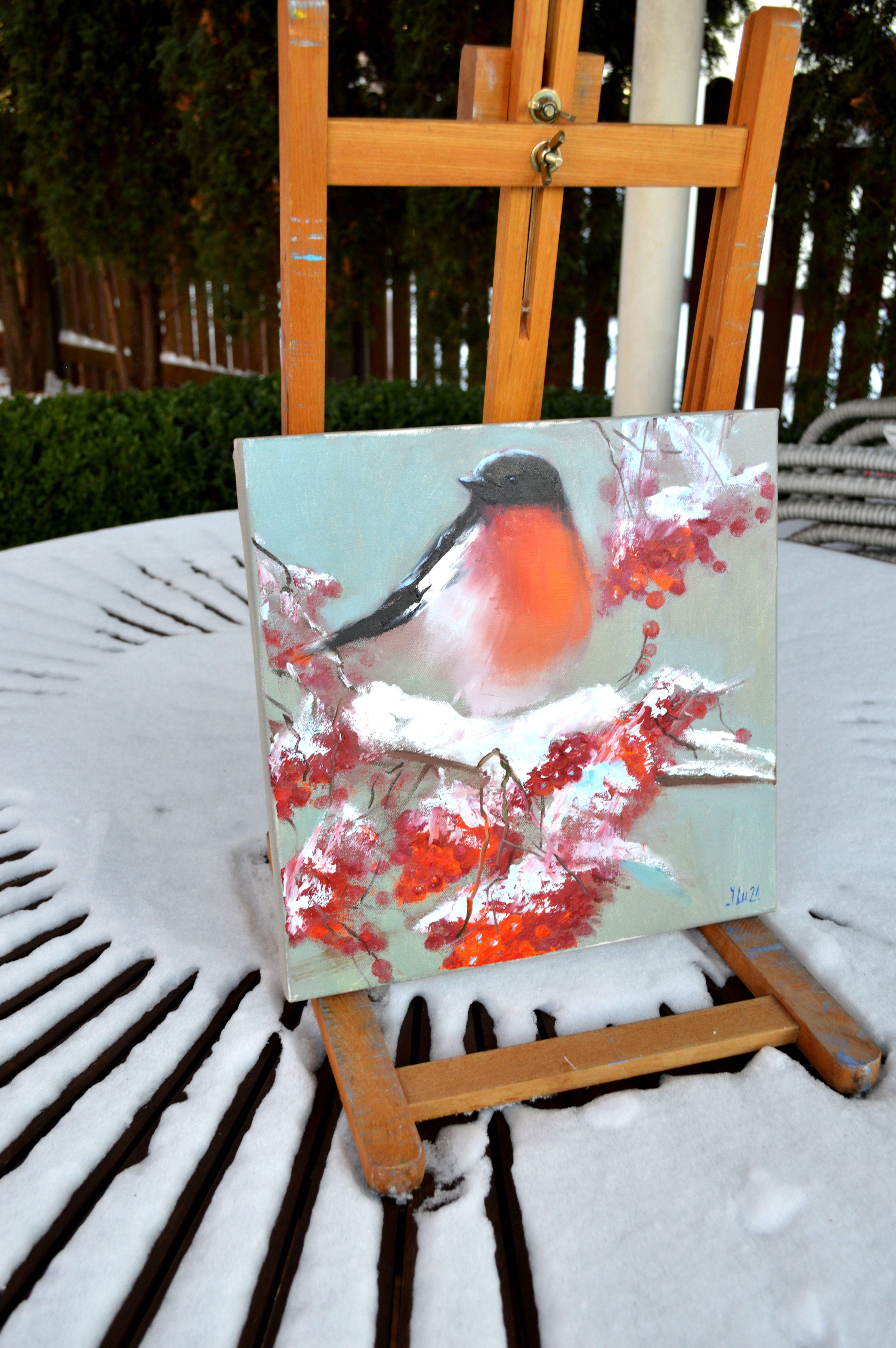 In this oil painting, I embraced the contrast of a vibrant bullfinch against a tranquil snowy backdrop. My strokes convey the bird's softness and strength, its vivid chest a beacon of warmth in winter's embrace. It's an expressionist celebration of