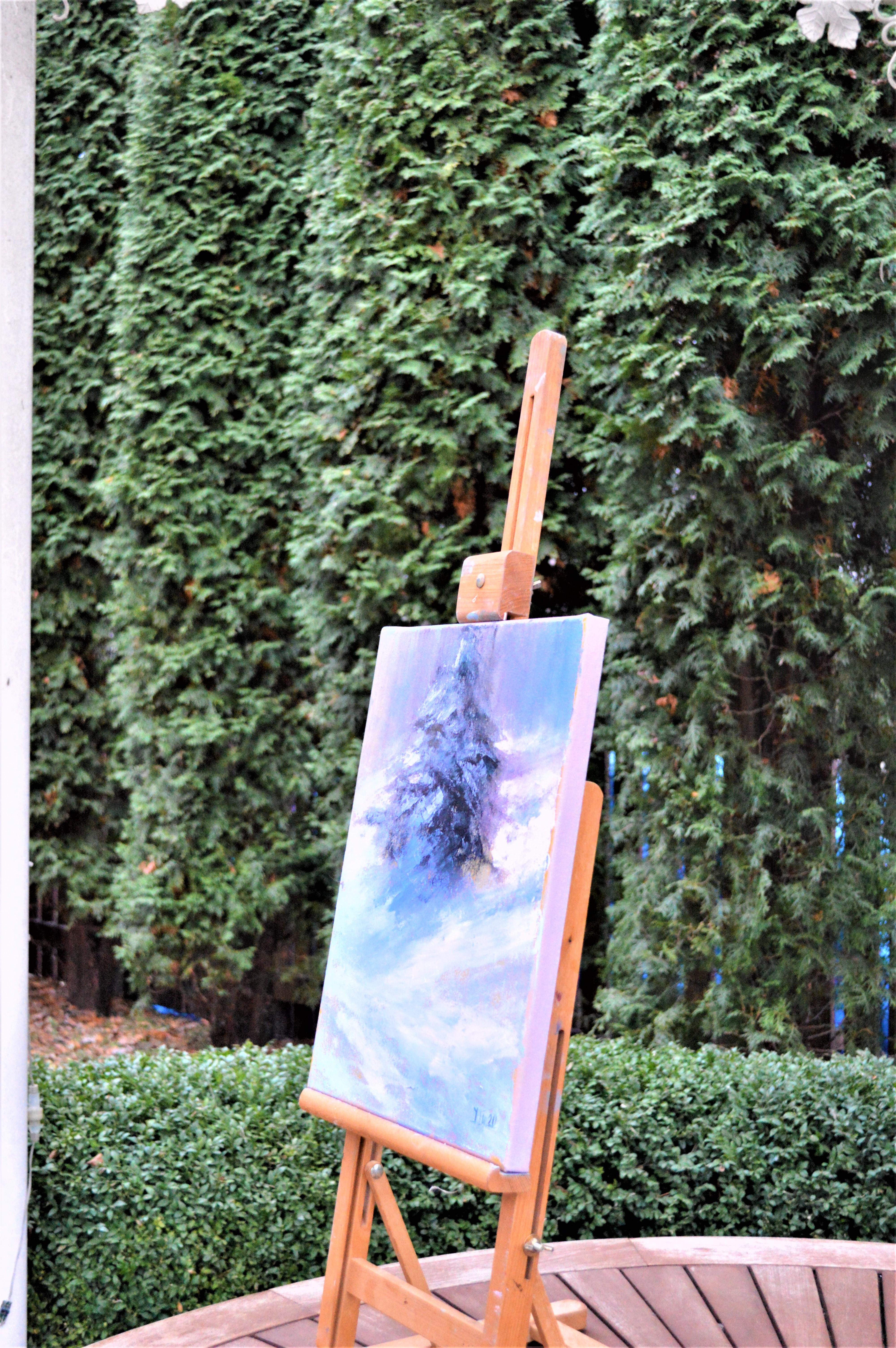 In my artwork, I've captured the serene majesty of a solitary evergreen standing resilient amidst a tranquil snowy landscape. Every stroke of my oil paints breathes life into the contrasting cool blues and the warmth of the earth, embodying the