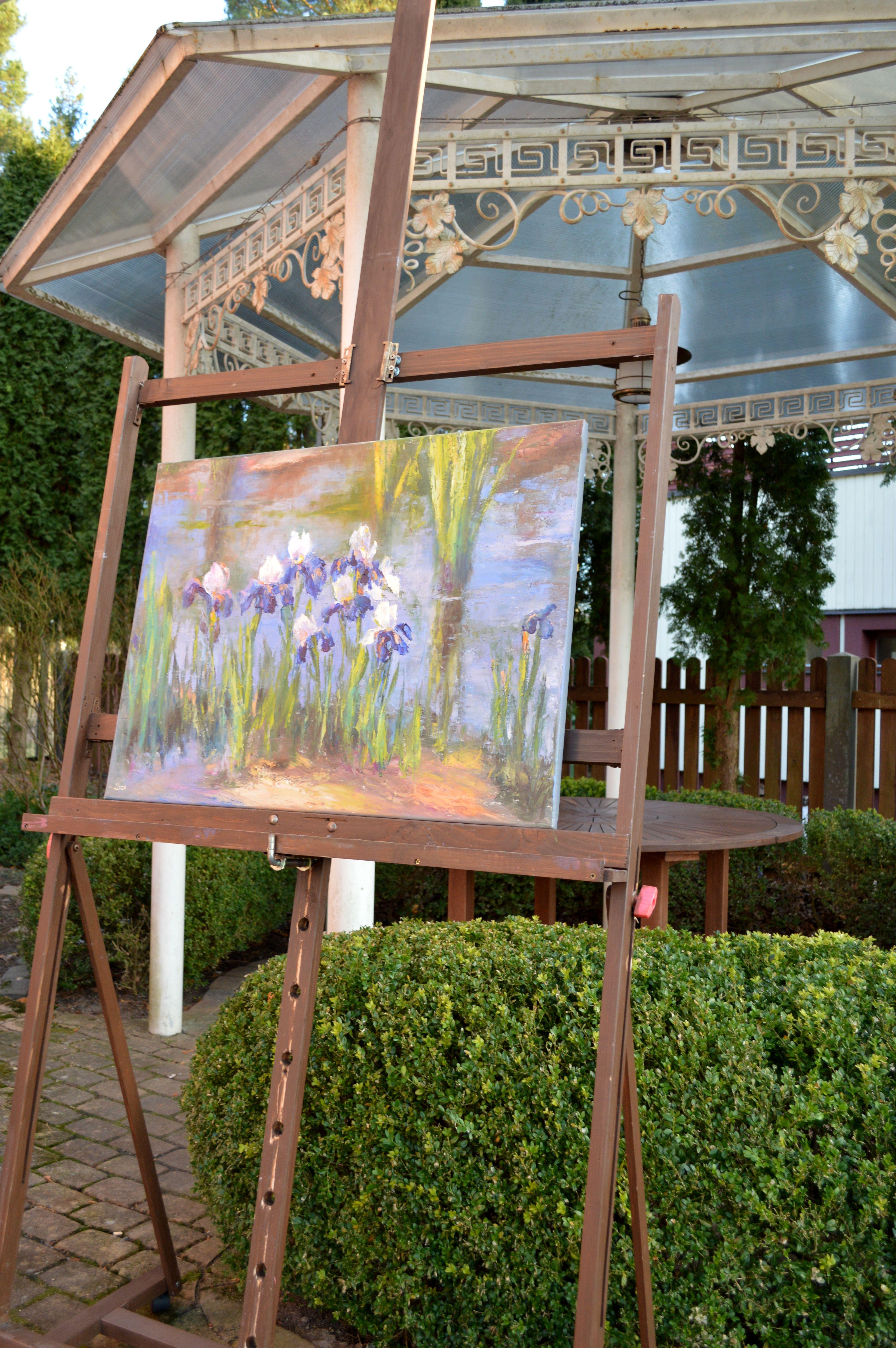 In this oil painting, I captured the essence of serenity and growth. Embracing the harmonious dance of light and shadow, I portrayed the irises with an impressionistic touch, evoking a sense of gentle movement in nature's stillness. This artwork