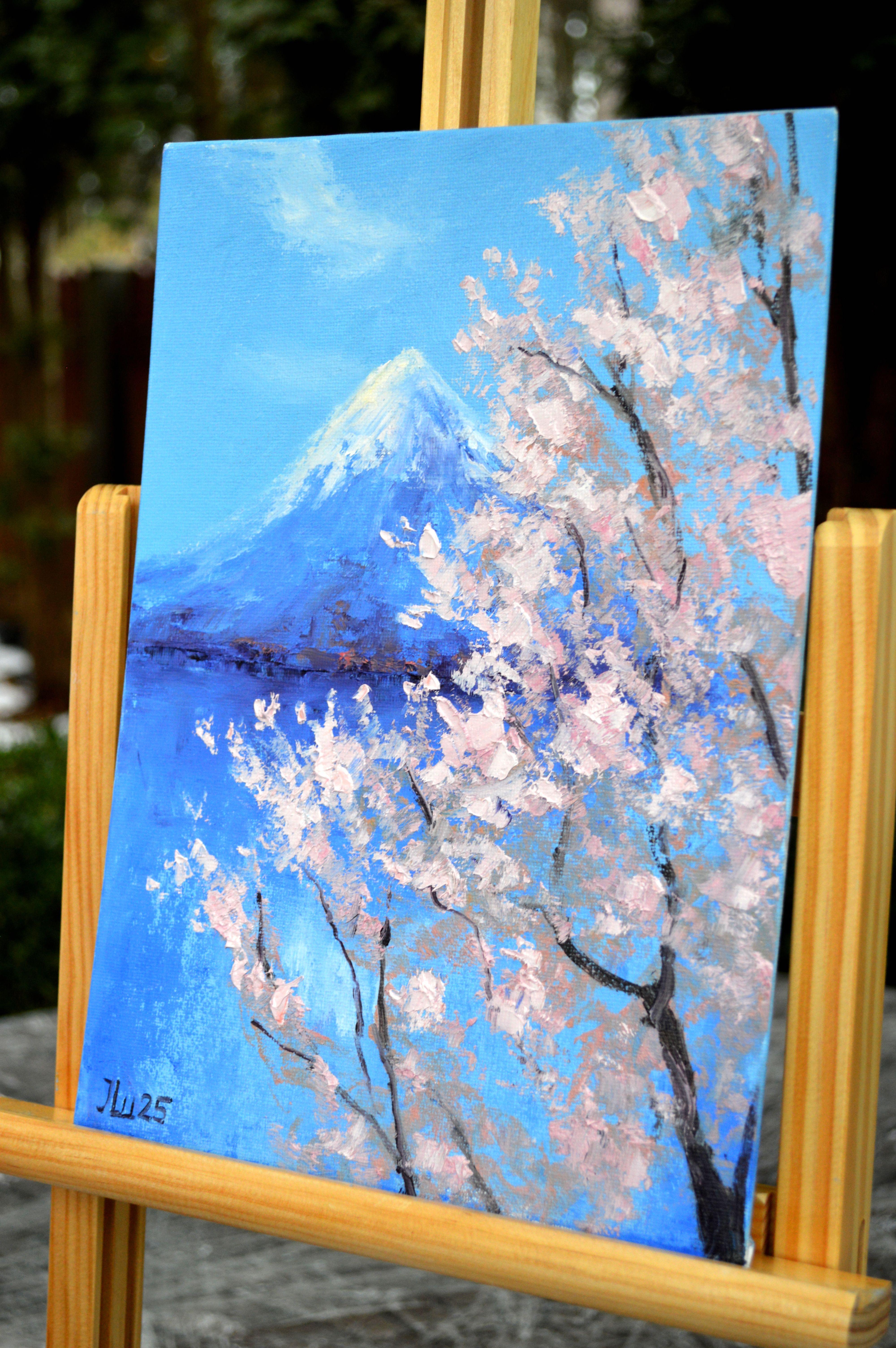 In this piece, I poured my soul into capturing the serene majesty of Mount Fuji framed by delicate cherry blossoms. Using oil paints, I blended impressionism and expressionism to evoke both the tranquility and power of nature. This painting radiates