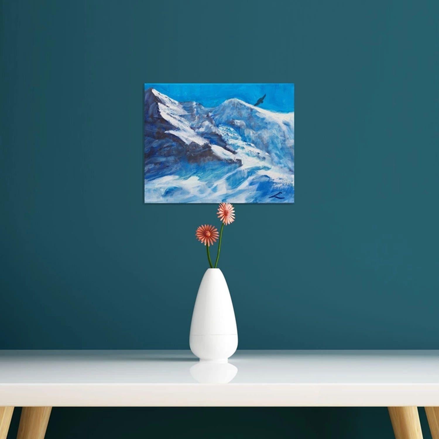 Das Bild zeigt ein Original-Ölgemälde, auf dem ein großer, schneebedeckter Berg vor einem strahlend blauen Himmel zu sehen ist. Die weiße Spitze des Berges hebt sich deutlich von der blauen Atmosphäre ab. Ein Adler, der den Berg oben rechts