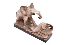 Grande sculpture en céramique émaillée Art Déco française représentant un éléphant et une panthère