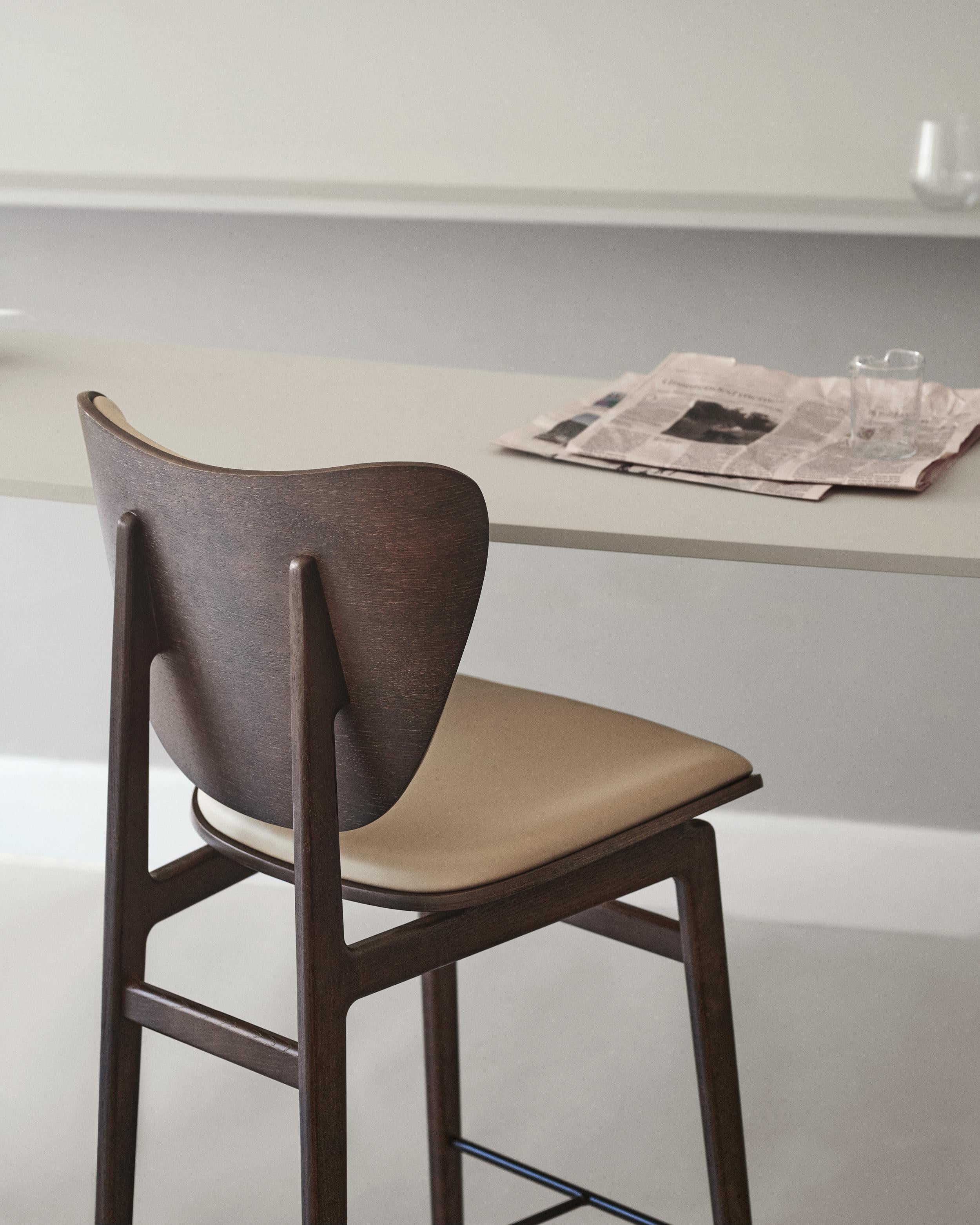 Elephant Bar Chair 75 by NORR11
Dimensions: D 46 x W 53 x H 111 cm. SH: 75/78,5 cm.
Materials: Natural oak, steel and upholstery.
Upholstery: Dunes Camel 21004. 

Available in different oak finishes: Natural oak, light smoked oak, dark smoked oak,