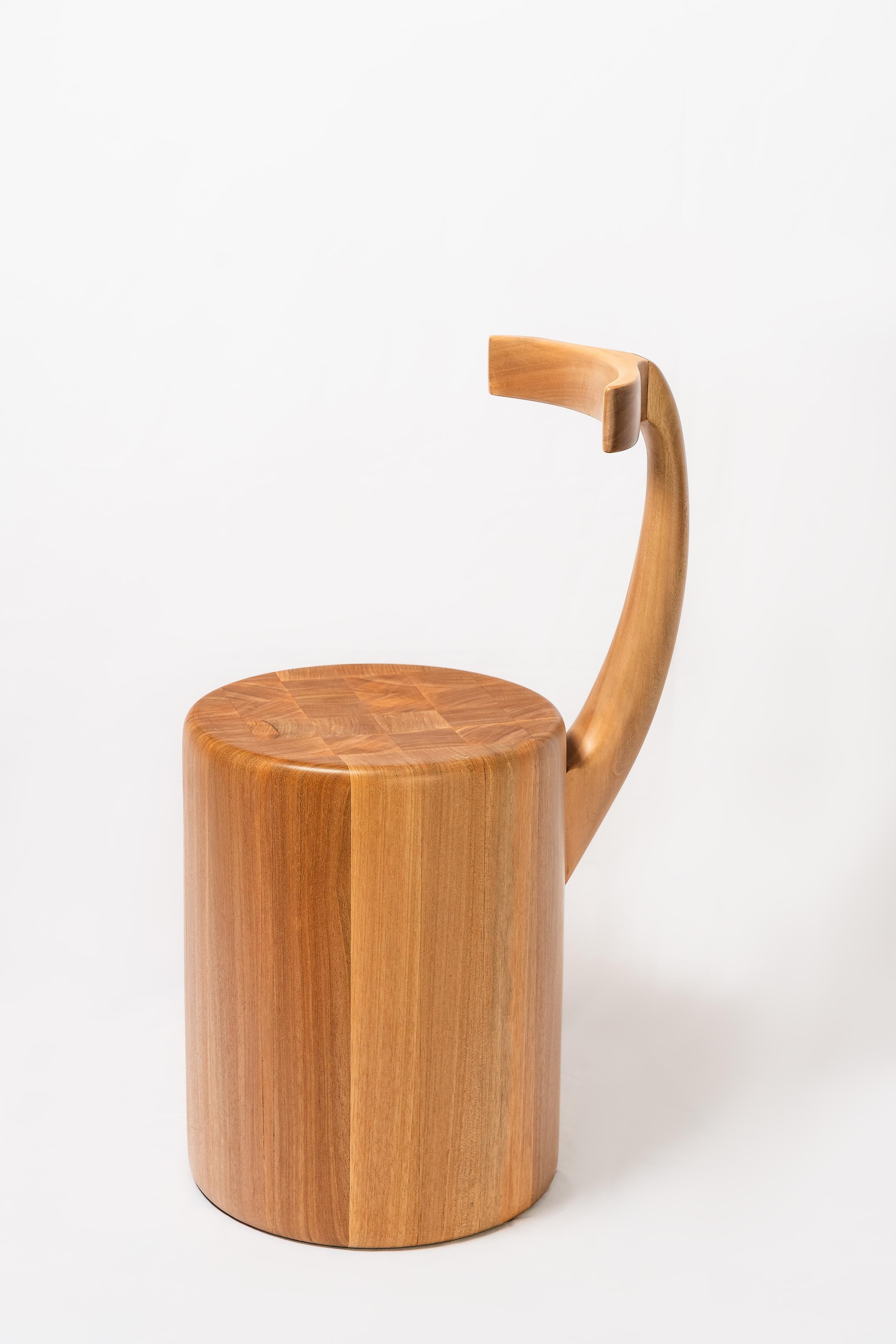 Designed with beauty, ergonomics and sustainability in mind, the elephant bench, produced on a wood lathe and hand-carved, was inspired by the elephant. With its sturdy, solid seat and its backrest displacing exuberant curves idealizing the trunk.