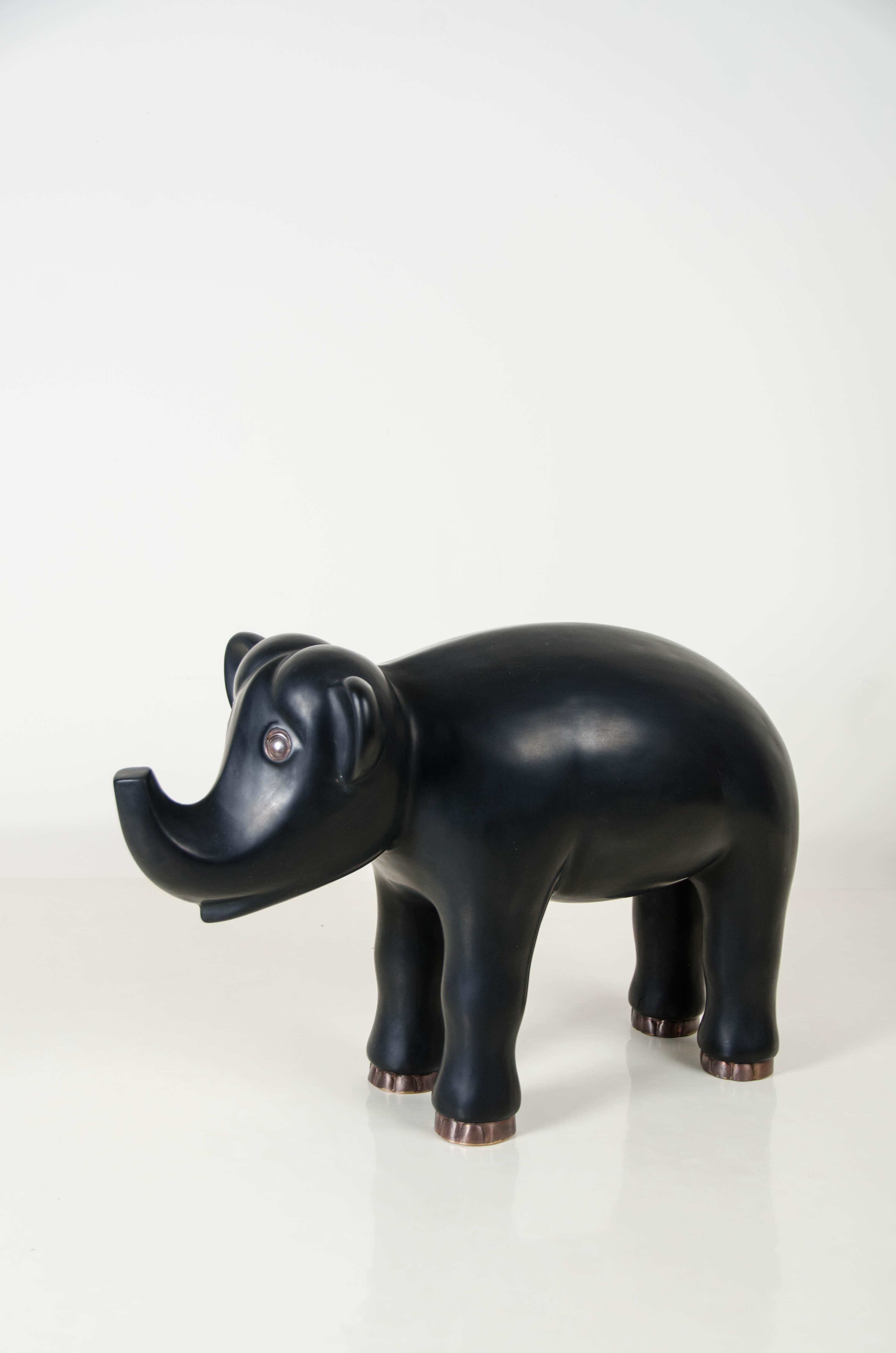 Elephant sculpture
Black Lacquer
Hand repoussé
Copperbase
Limited edition

Repousse is the traditional art of hand-hammering decorative relief onto sheet metal. The technique originated around 800 BC between Asia and Europe and in Chinese historical