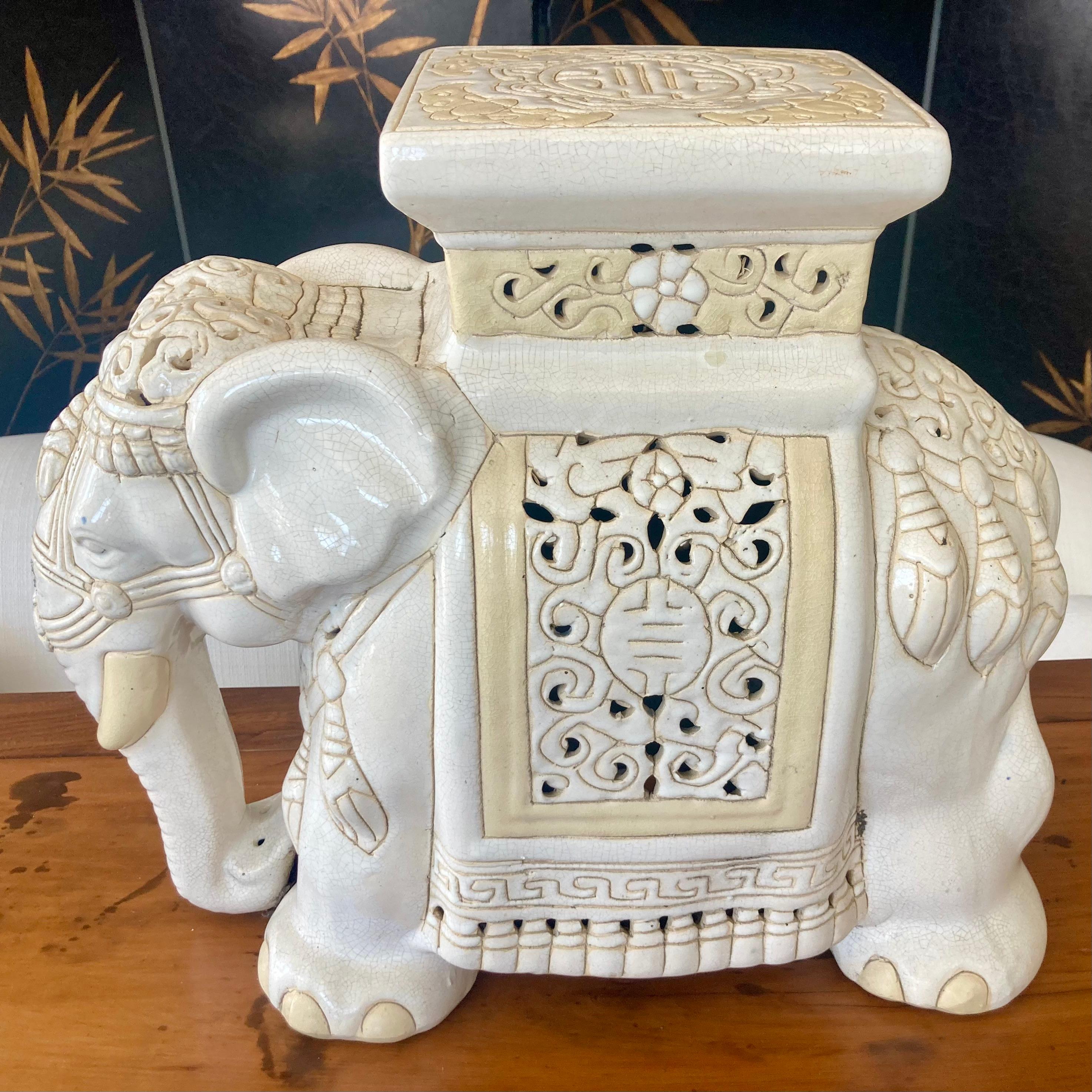 Elephant blanc glazed ceramic garden seat or cocktail table. Gorgeous hand details makes this an interesting conversation piece. Great additional seating too. Add some Boho Chic style to your design project.