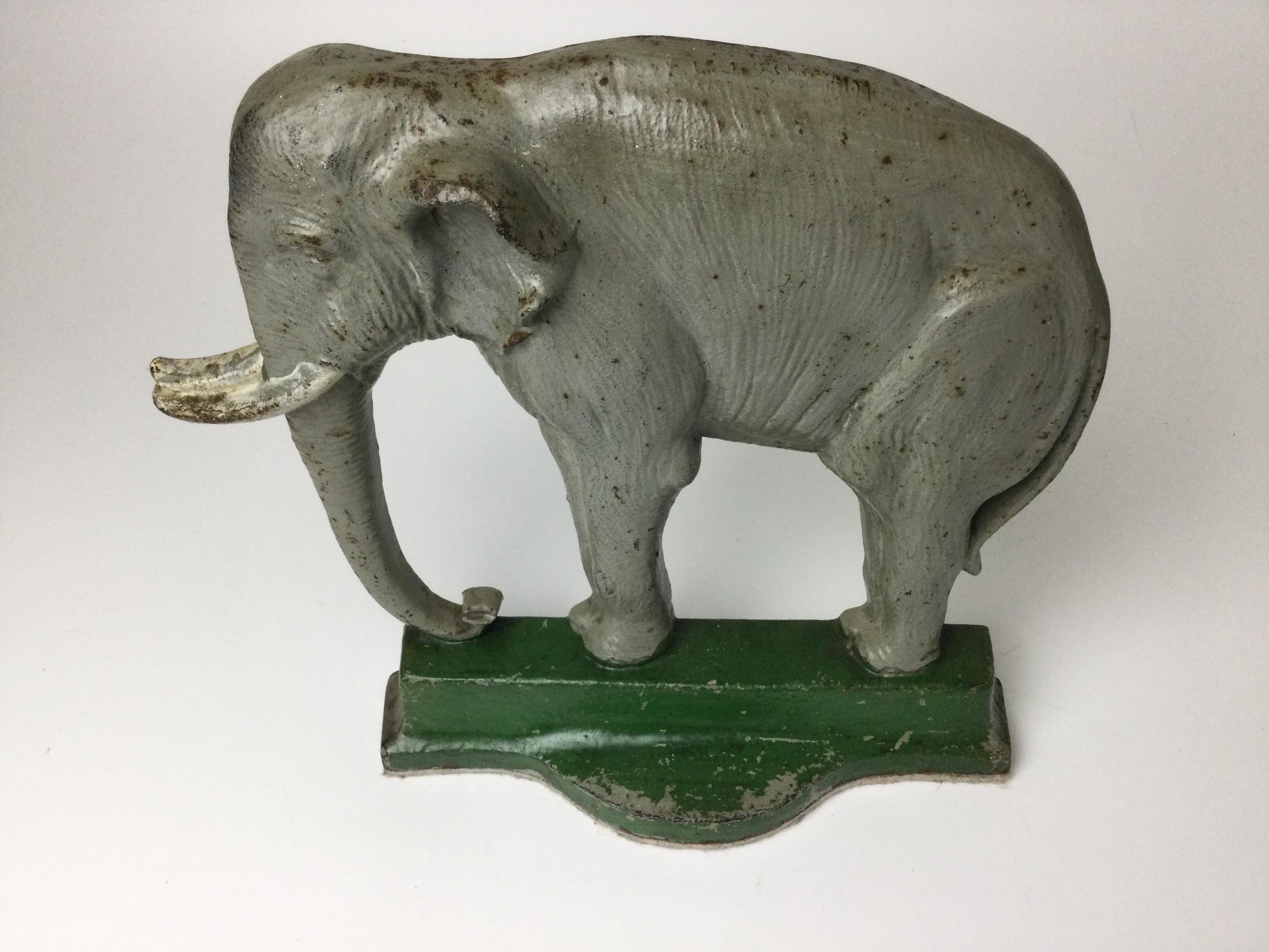 Early 20th c. cast iron Elephant form doorstop by Bradley & Hubbard, original painted surface, back is marked 'B&H' and '7799', 10 3/4