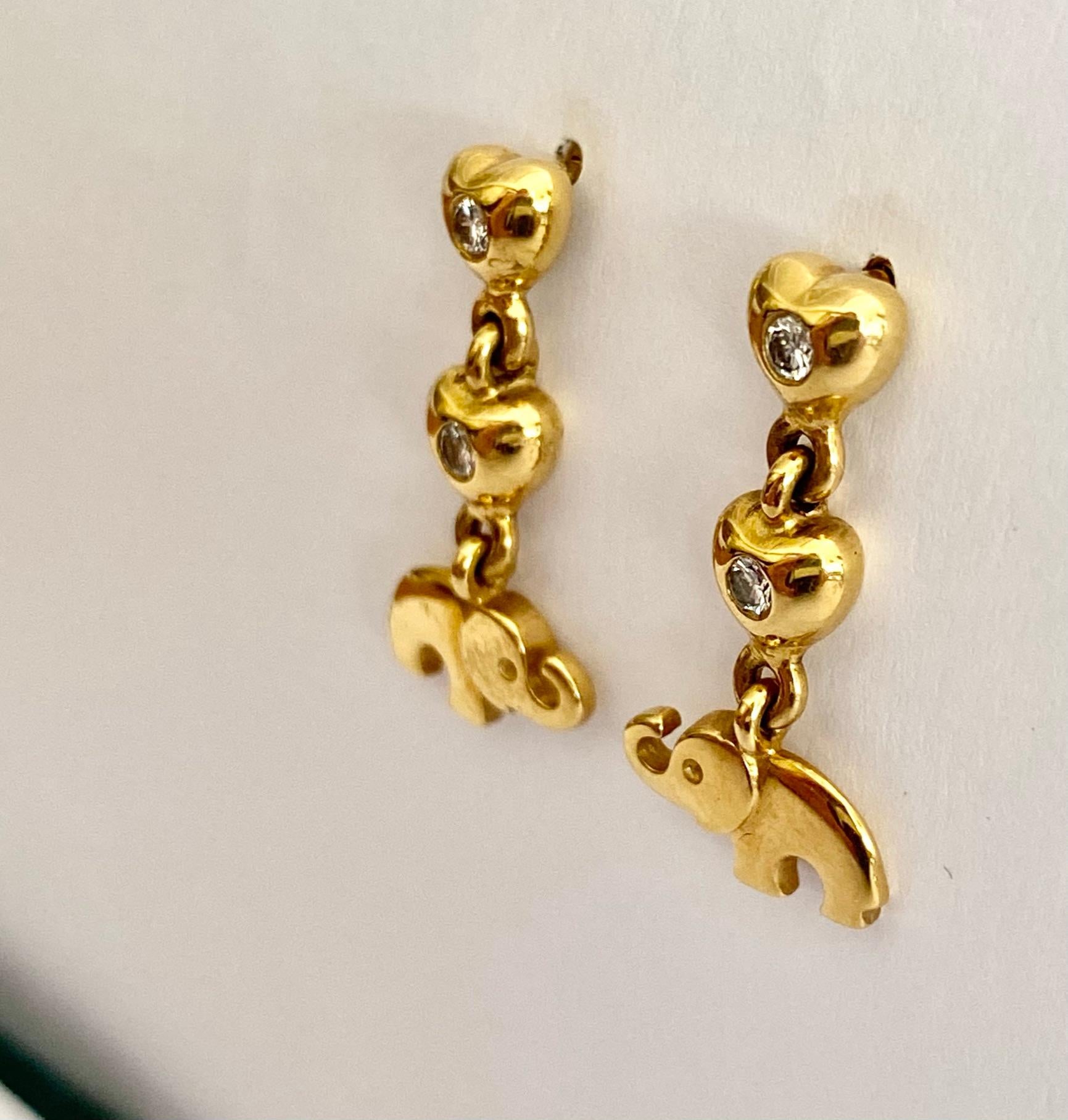 One (1) 18 karat Yellow Gold pair of Earrings, stamped 750 & C'est Laudier.
Made in Germany ca 1995  
4 round Brilliant cut Diamonds = 0.22 ct VS - G 
Weight: 6.21 grams
Measurements:   22 x 10 x= 2 mm
New Old Stock.