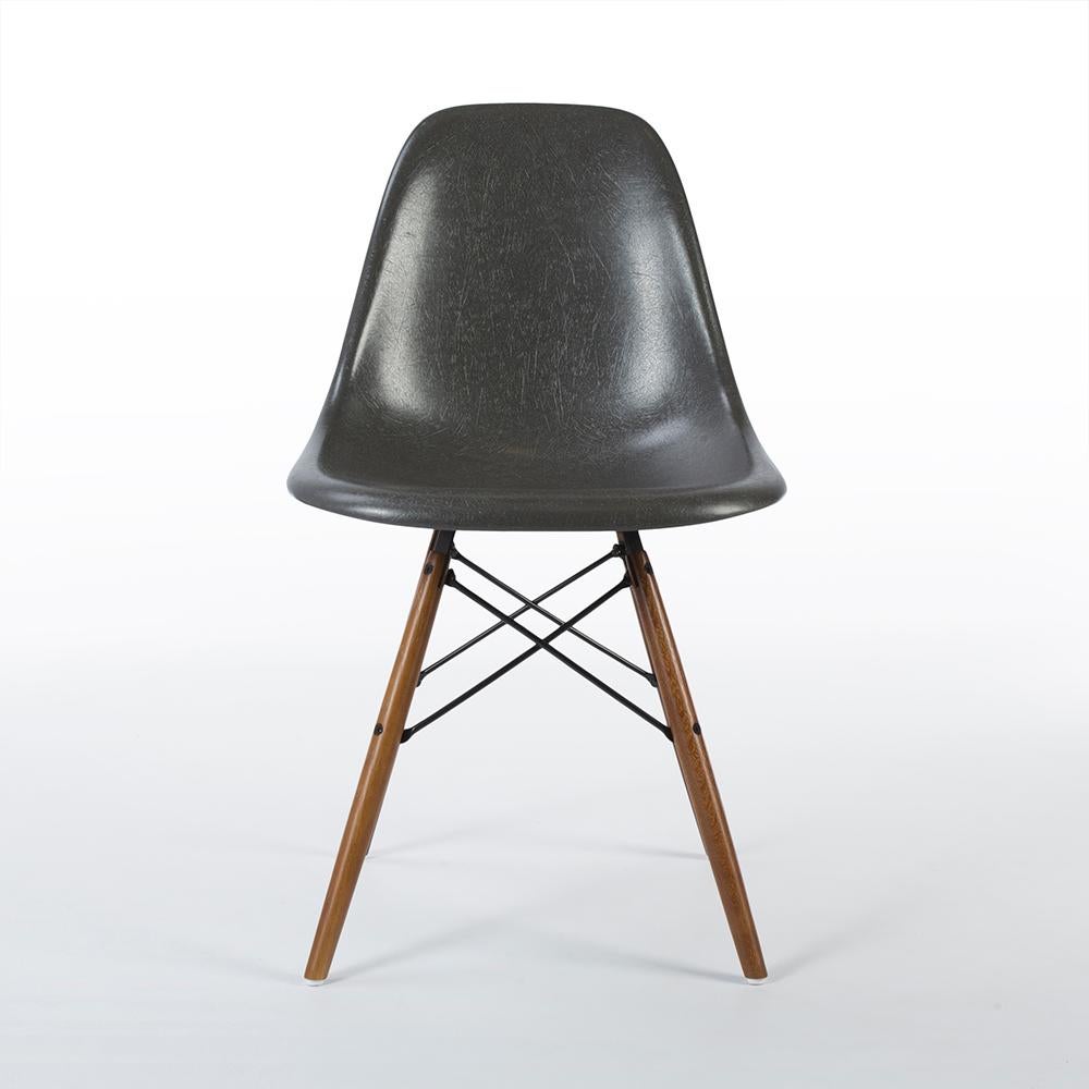 A new, used, Vitra, original Eames, fiberglass side shell chair finished in Elephant Hide Grey on its similarly new, used, light oak DSW dowel base.
Vitra have faithfully re-introduced their own version of the fiberglass shells only last year and