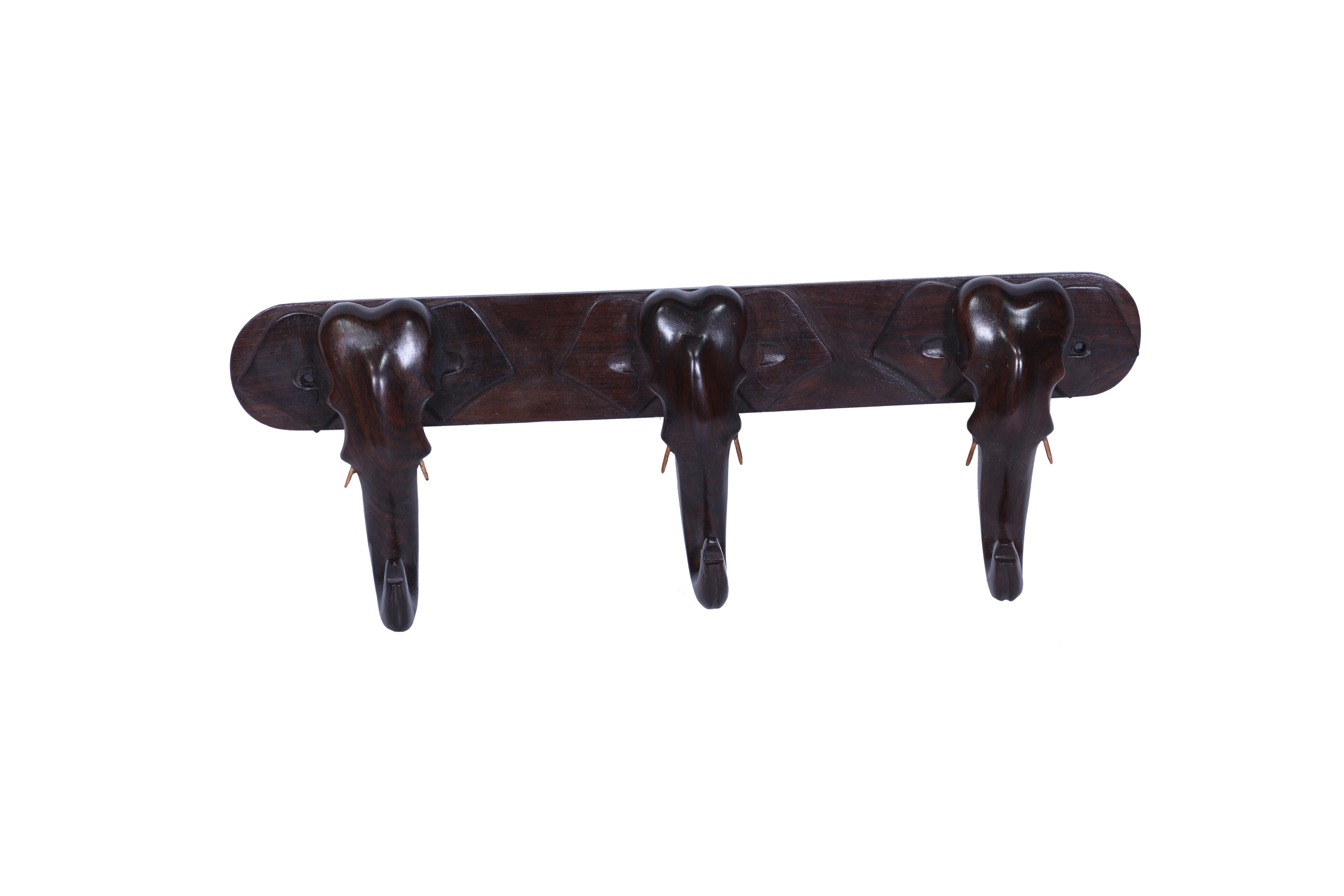 Whimsical and elegant, a wall mounted coat or hat rack.  This one is made of rosewood with four elephant faces where the trunks of the elephant become the hooks themselves.  As of this writing, we have two of these.  Unusual and unexpected.

The