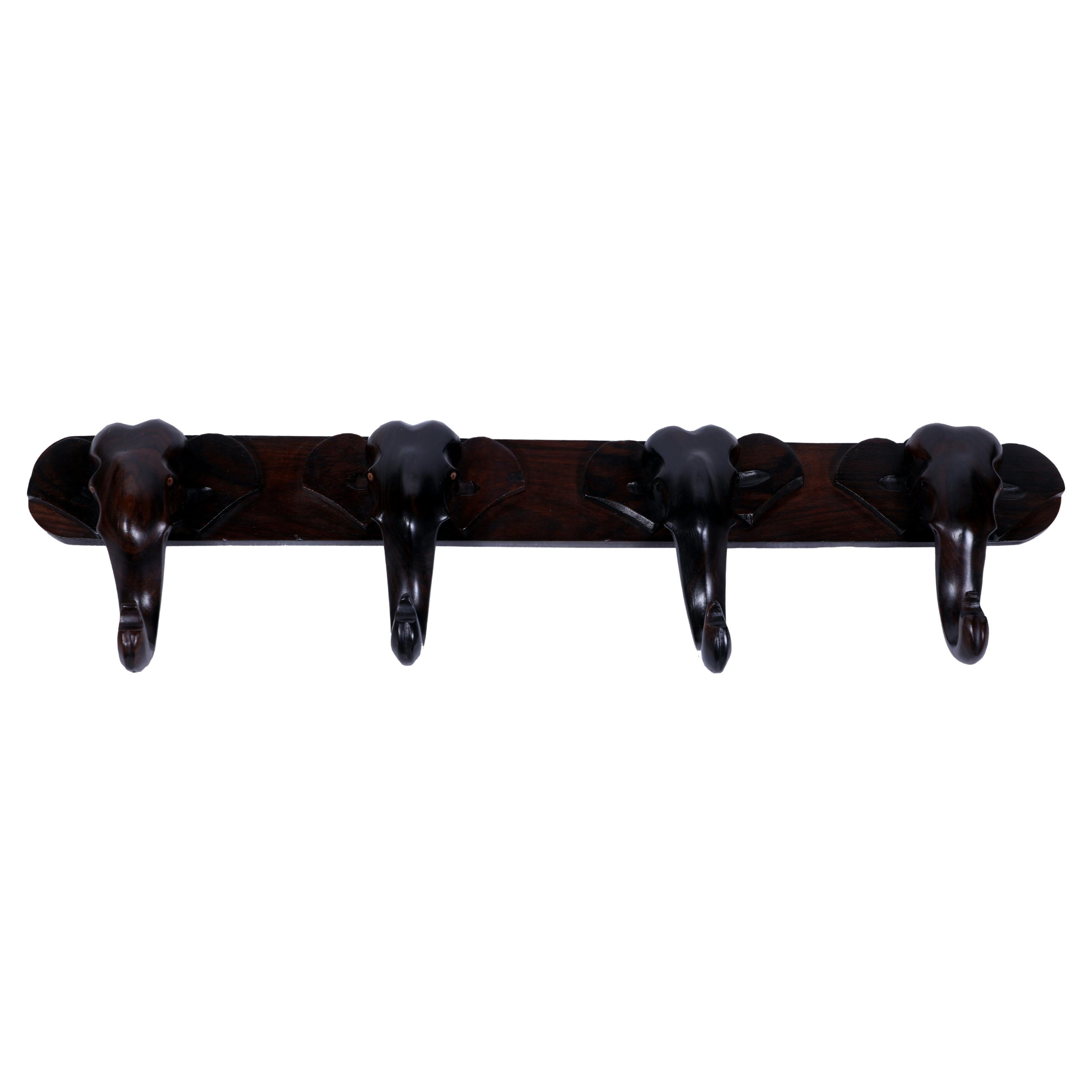 Whimsical and elegant, a wall mounted coat or hat rack.  This one is made of rosewood with four elephant faces where the trunks of the elephant become the hooks themselves.  As of this writing, we have two of these.  Unusual and unexpected.

The