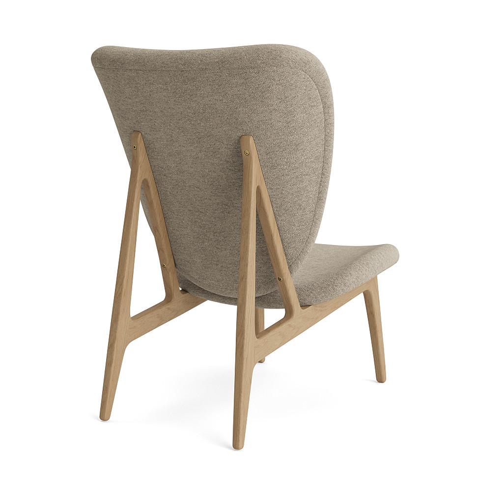 Elephant lounge chair 
Signed by Kristian Sofus Hansen and Tommy Hyldahl for Norr11, 2017

Model shown on the picture:
Full upholstery

Wood: Natural oak
Fabric: Barnum Bouclé 03

Wood types available: natural oak / light smoked oak / dark