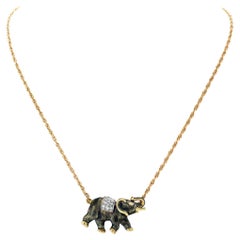 Vintage Elephant necklace in 14k gold with 0.25 carats in diamond accents G-H color,