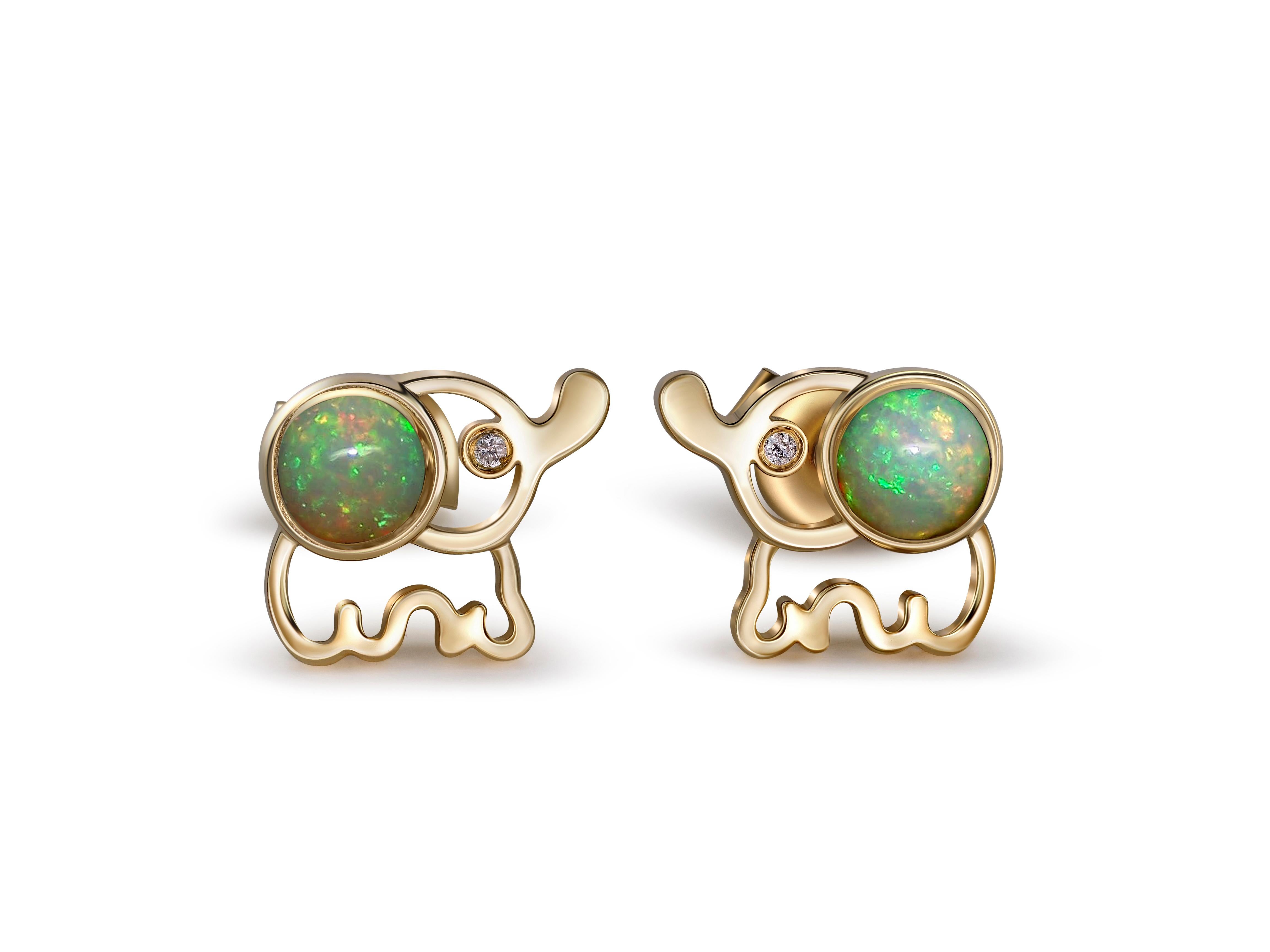 Elephant Opal 14k gold earrings studs. 
Animal design gold earrings. Multicolor opal earrings. Cabochon opal earrings. October birthstone earrings. 

Total weight: 2.2 g.
Size: 7 x 8 mm.
Central stones: Natural opals - 2 pieces
Weight: approx 0.85