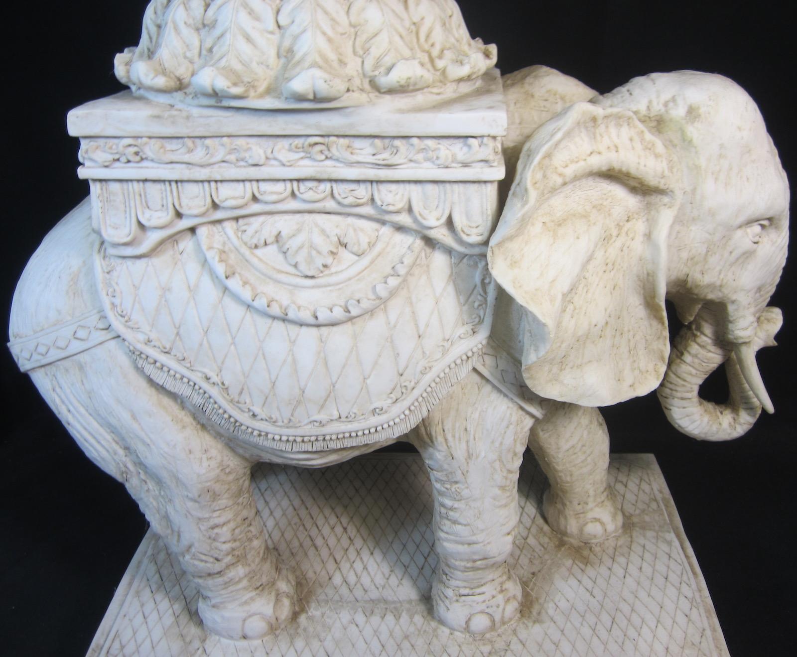 Elephant table, 
round glass top, 
composite material, 
weighs 22kg, 
Measures: 55 x 58cm high.