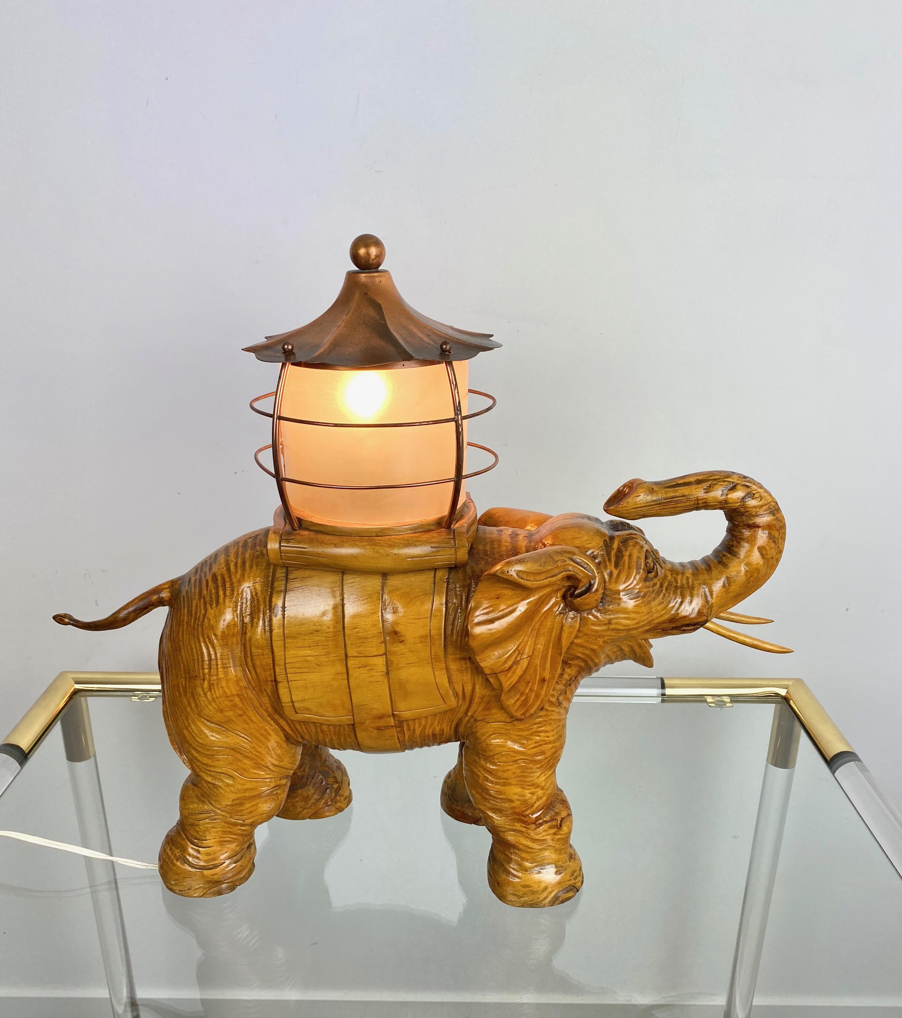 Not many Aldo Tura pieces can be compared to this unique table lamp, hand carved from a single piece of wood. Aldo Tura lamps were done in small editions and the detail and level of sophistication in carving on this particular lamp would be