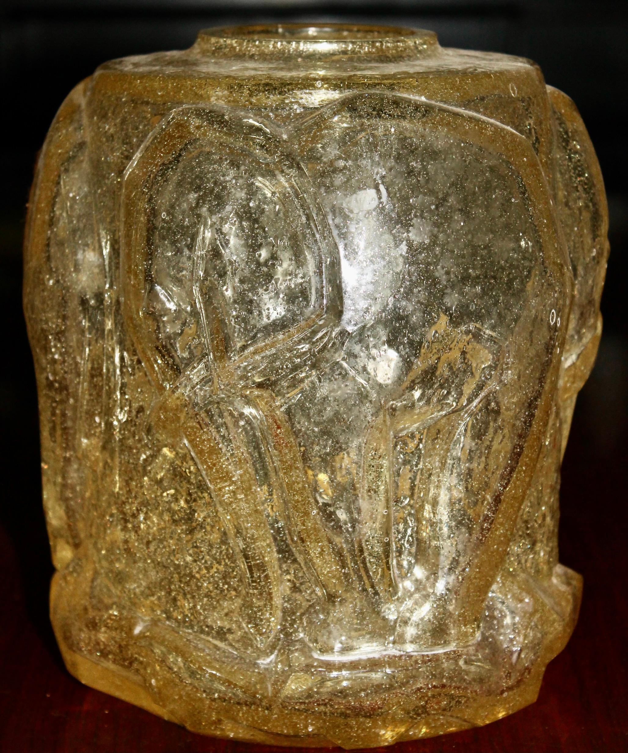 Gold yellow heavy glass vase circled with elephants in low relief.
In the manner of Pierre D'Avesn and unsigned.