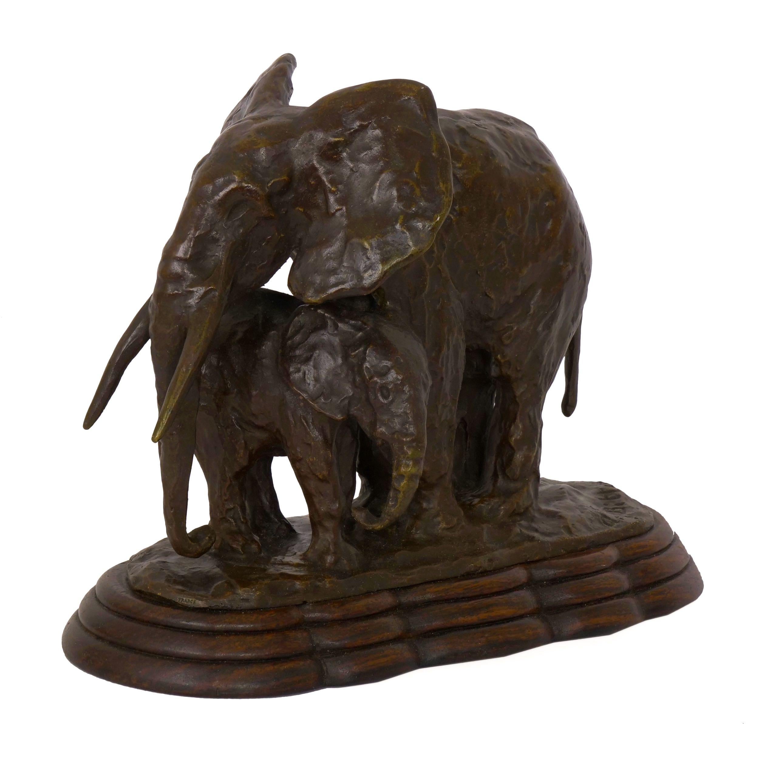 A rich and sensitive work, this fine sculpture beautifully depicts the protective nature of the proud Elephant as she stands over her young. The loose impressionism and rough working of the model is captured in the bronze in a way that leaves us