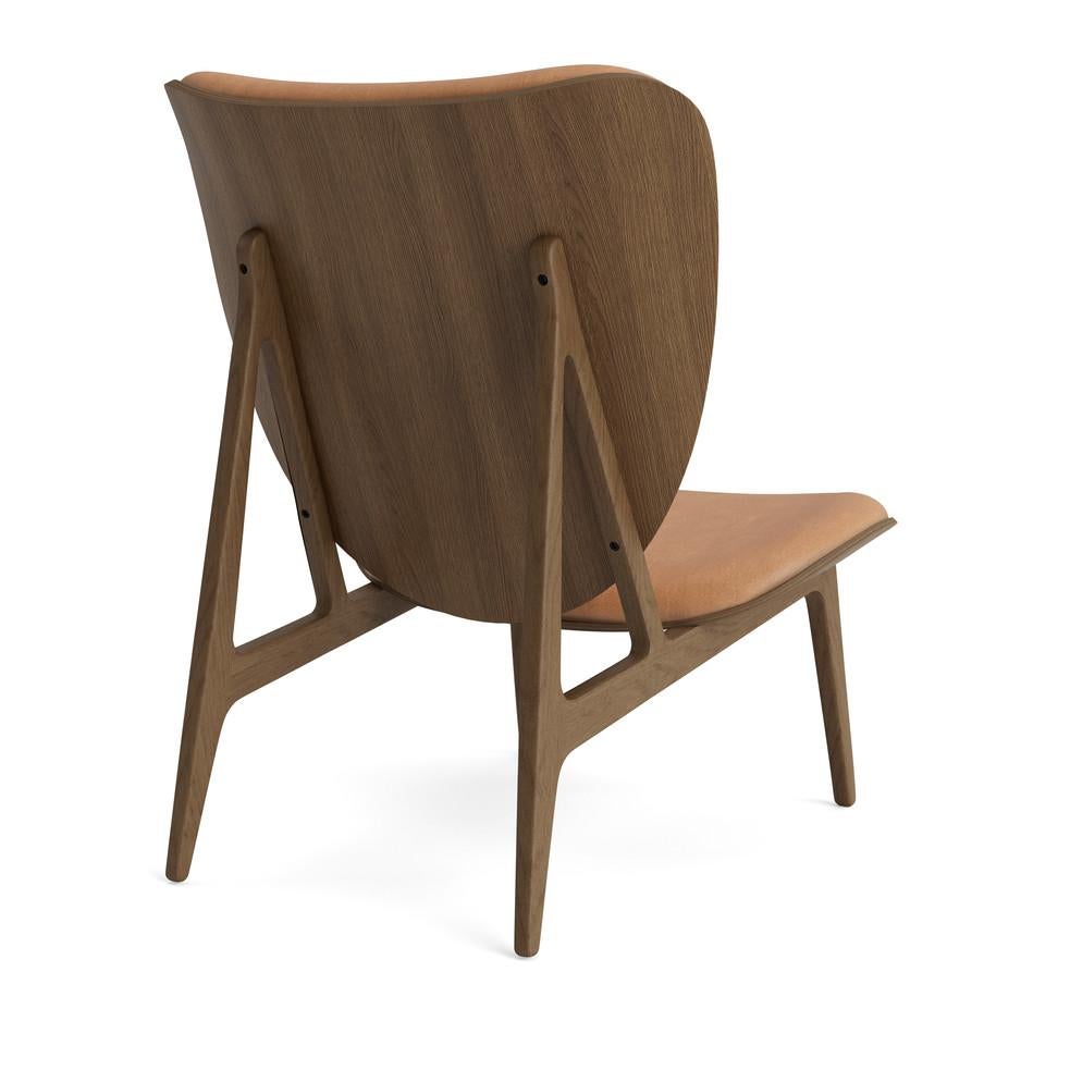 Elephant lounge chair 
Signed by Kristian Sofus Hansen and Tommy Hyldahl for Norr11, 2017

Model shown on the picture:
Wood: Light Smoked Oak
Fabric: Dunes Camel 21004

Wood types available: natural oak / light smoked oak / dark smoked oak /