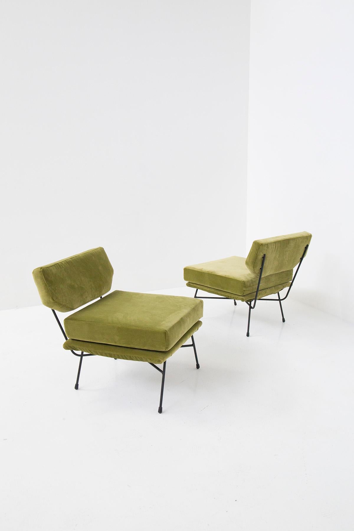 Pair of armchairs Model Elettra designed by Studio B.B.P.R. for the Arflex manufacture in 1953. Black metal tubular frame, seat and back upholstered in shaped polyurethane. The pair of armchairs has been upholstered in an elegant green