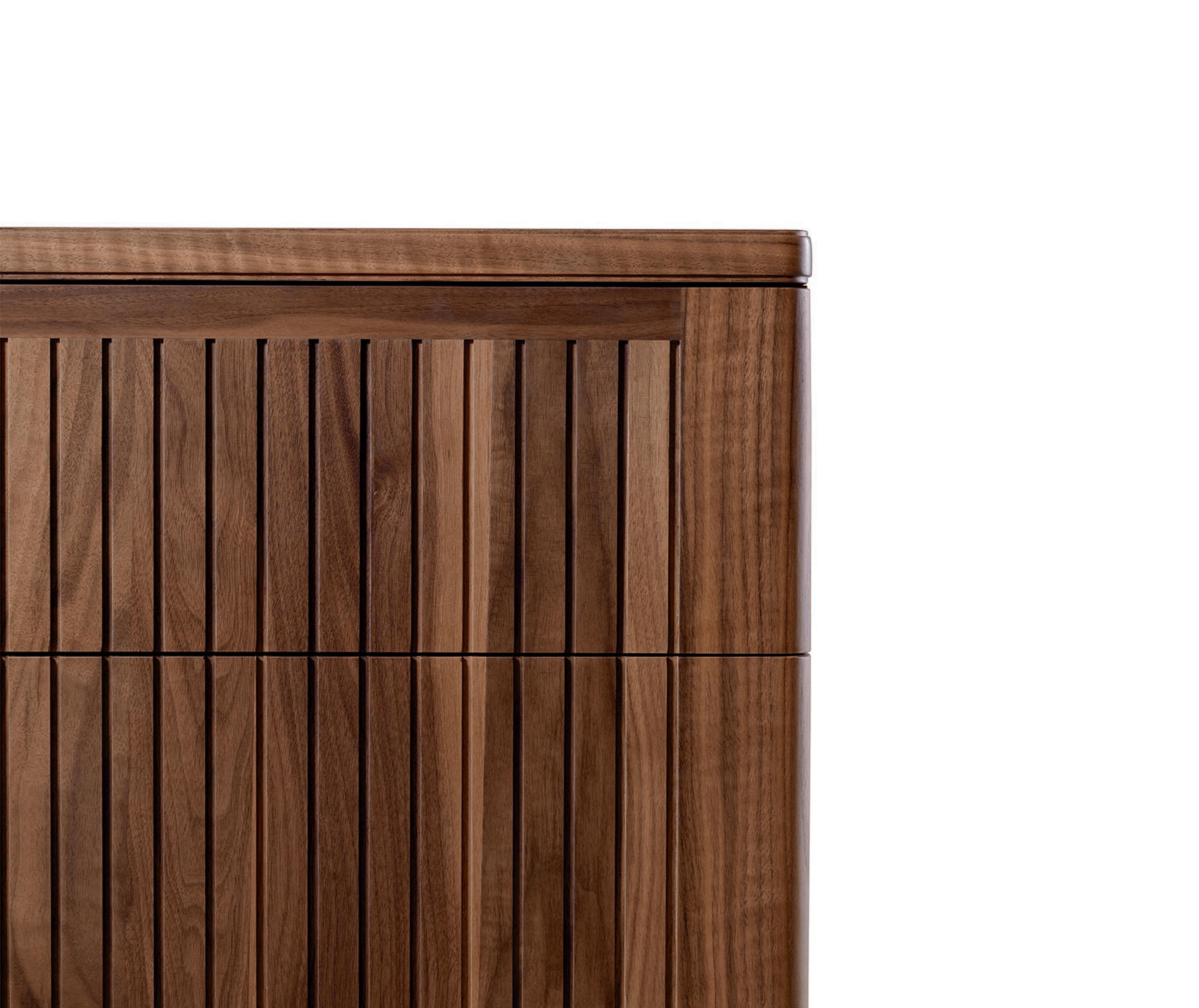 Eleva Bedside Table by Dale Italia
Dimensions: D 42 x W 60 x H 50 cm.
Materials: Walnut.

Frame in walnut veneer blockboard with solid edging. Available in two different sizes and two finishes: natural and grey walnut. Prices may vary. Please