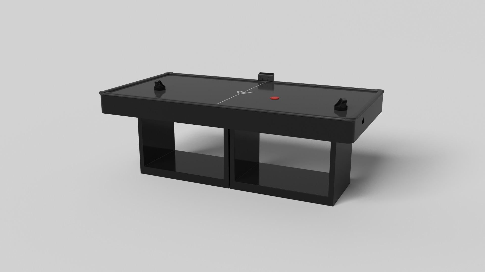 Supported by two rectangular open pedestals as the base, this handcrafted air hockey table is modern and minimalistic with its combination of simple, geometric forms. Viewed from the front, the use of negative space is evident; viewed from the side,