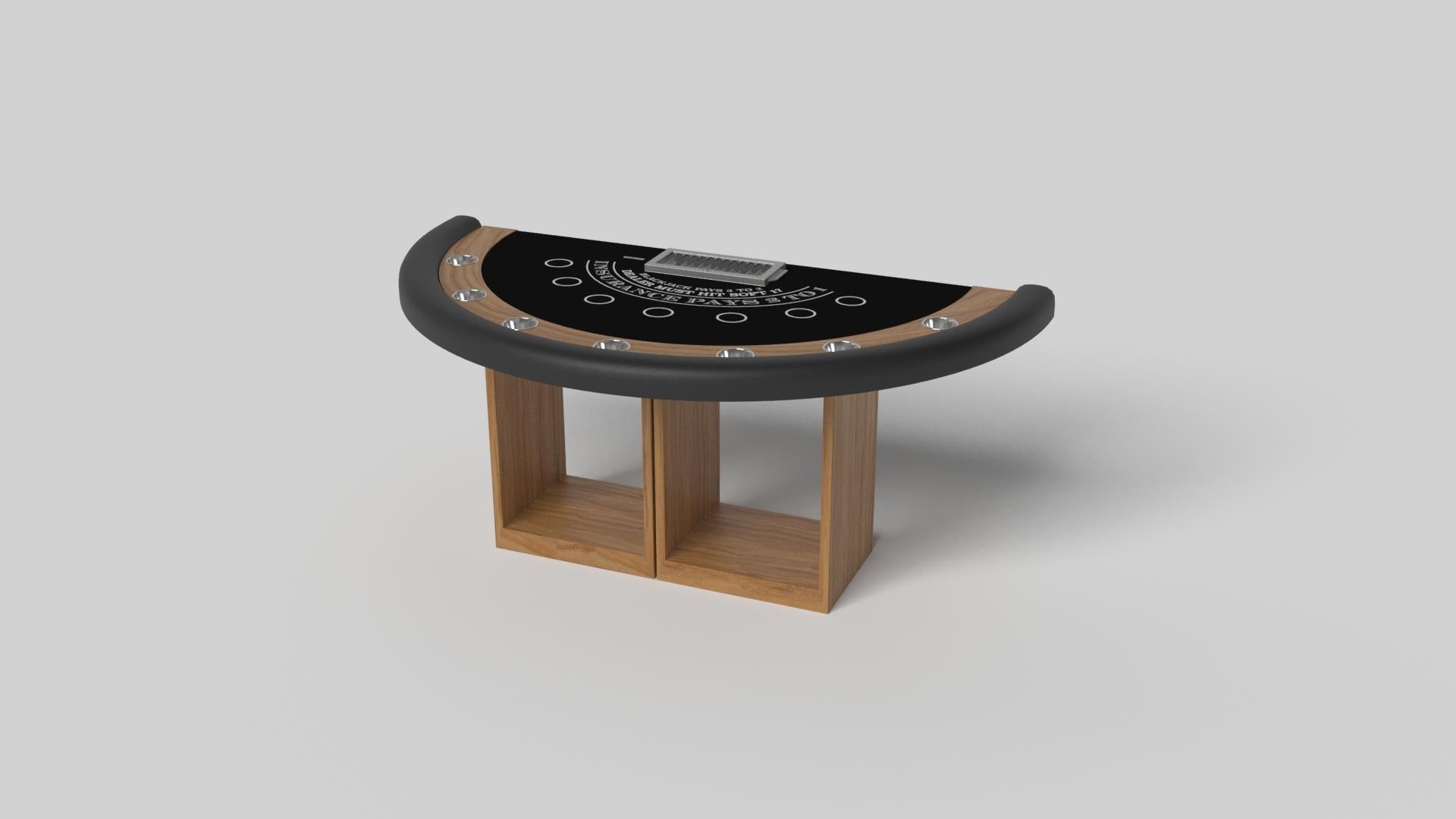 Soutenue par deux piédestaux rectangulaires ouverts en guise de base, la table de blackjack Ambrosia est moderne et minimaliste avec sa combinaison de formes simples et géométriques. Vue de face, l'utilisation de l'espace négatif est évidente ; vue
