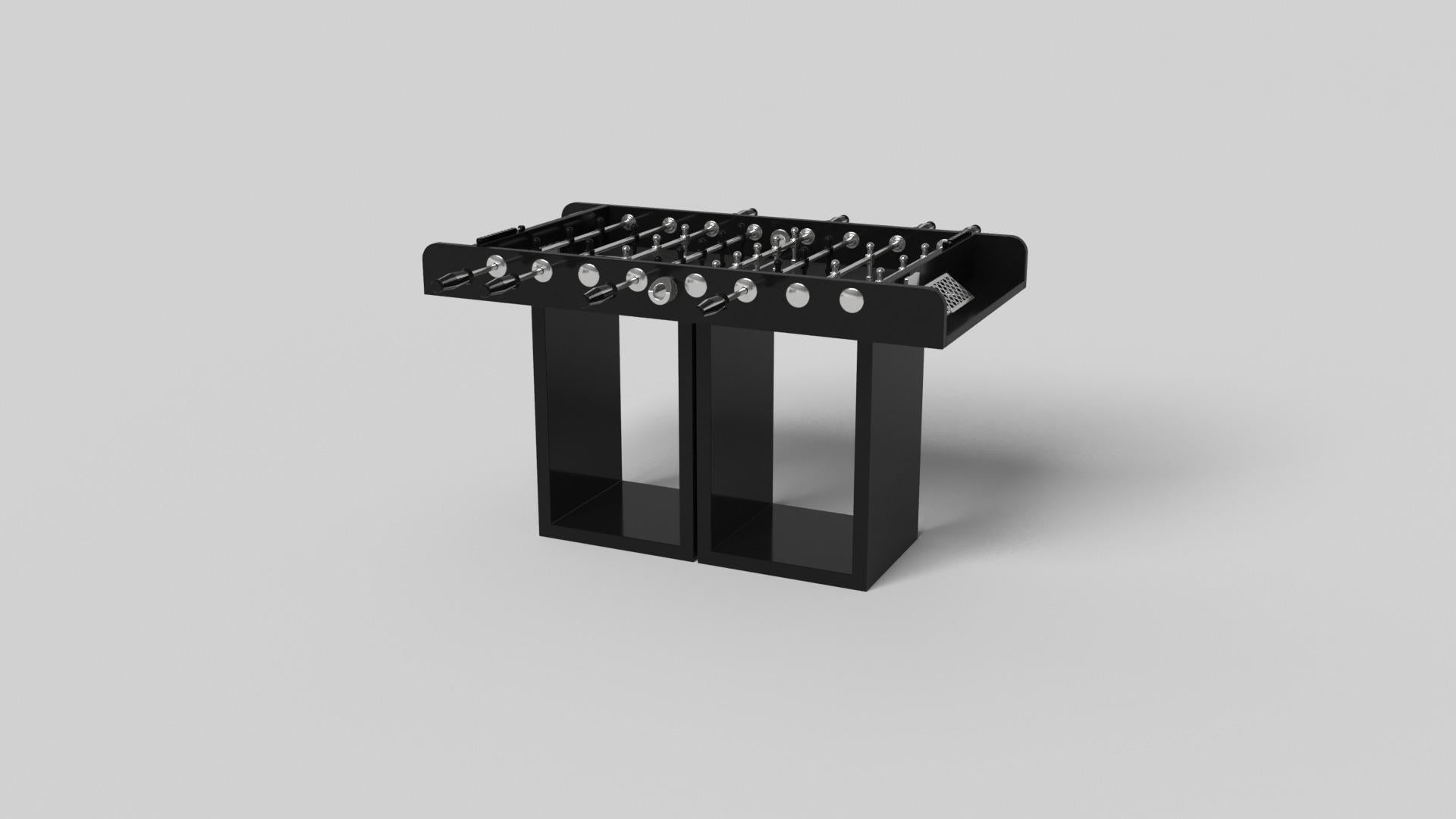 Supported by two rectangular open pedestals as the base, this handcrafted foosball table is modern and minimalistic with its combination of simple, geometric forms. Viewed from the front, the use of negative space is evident; viewed from the side,
