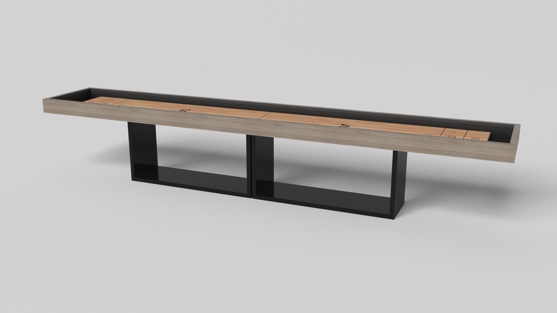 Supported by two rectangular open pedestals as the base, this handcrafted shuffleboard table is modern and minimalistic with its combination of simple, geometric forms. Viewed from the front, the use of negative space is evident; viewed from the