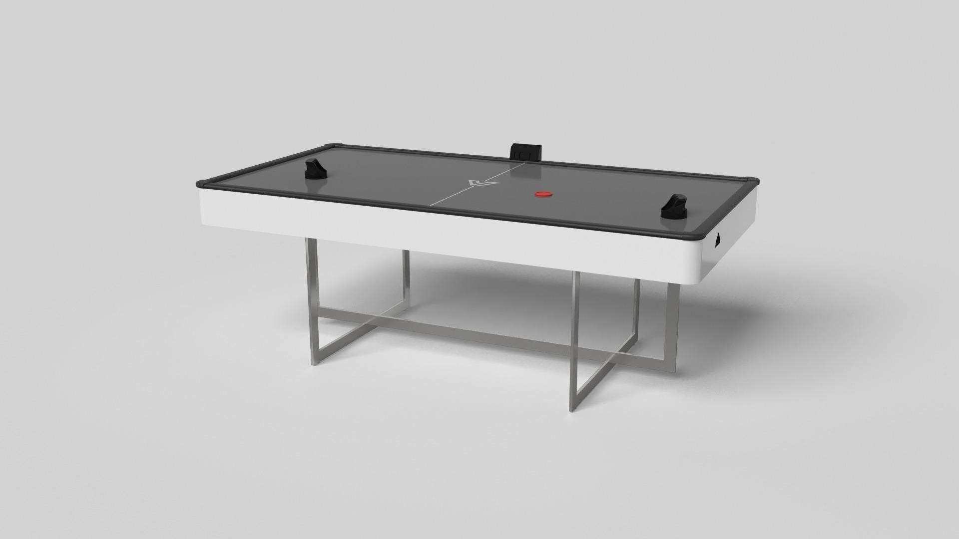 Avec une base ouverte en métal, notre table Beso est une expression unique de formes contemporaines et d'espace négatif. Cette table d'air hockey est fabriquée à la main par nos maîtres artisans avec une base rectangle dans rectangle qui reprend les