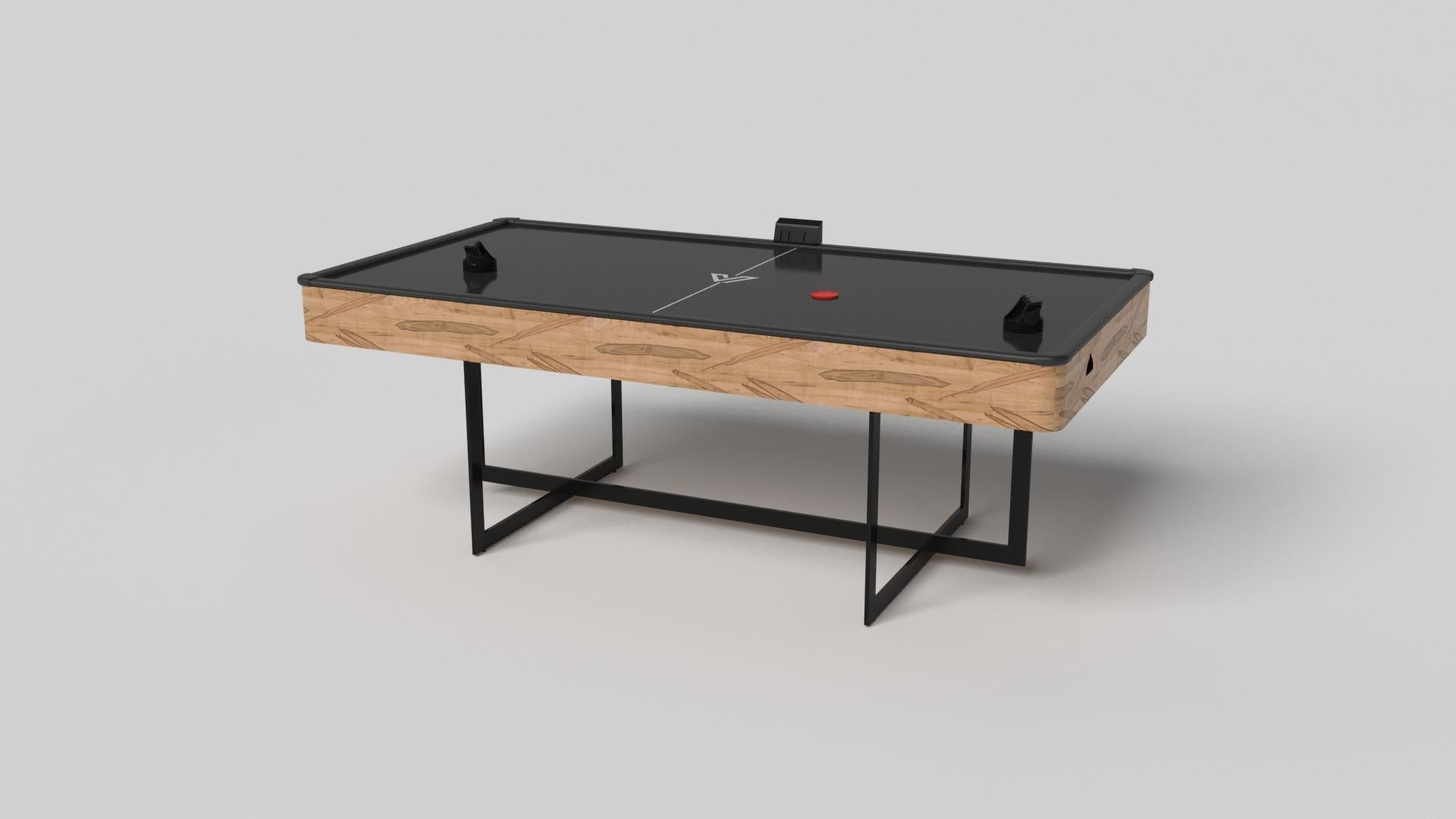 With an open metal foundation, our Beso table is a unique expression of contemporary forms and negative space. This air hockey table is handcrafted by our master artisans with a rectangle-in-rectangle base that echoes the angles and edges of a