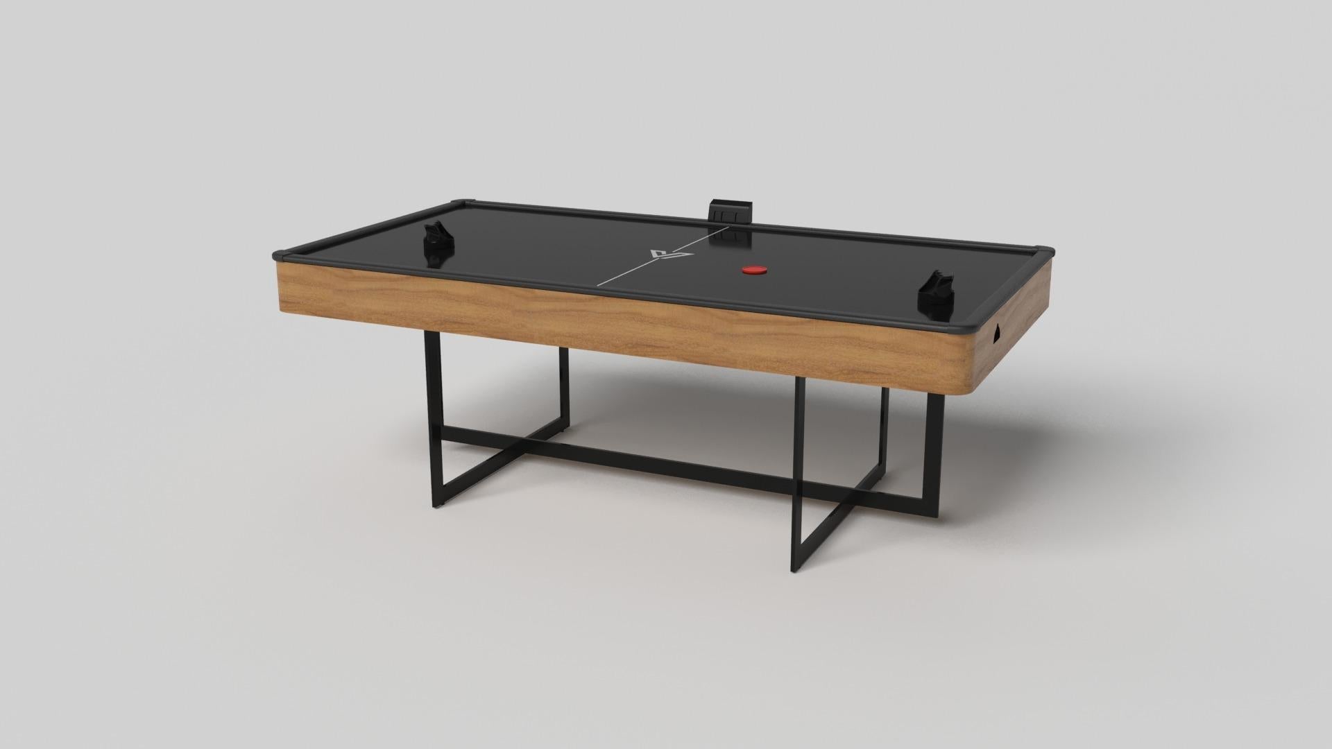 Avec une base ouverte en métal, notre table Beso est une expression unique de formes contemporaines et d'espace négatif. Cette table d'air hockey est fabriquée à la main par nos maîtres artisans avec une base rectangle dans rectangle qui reprend les