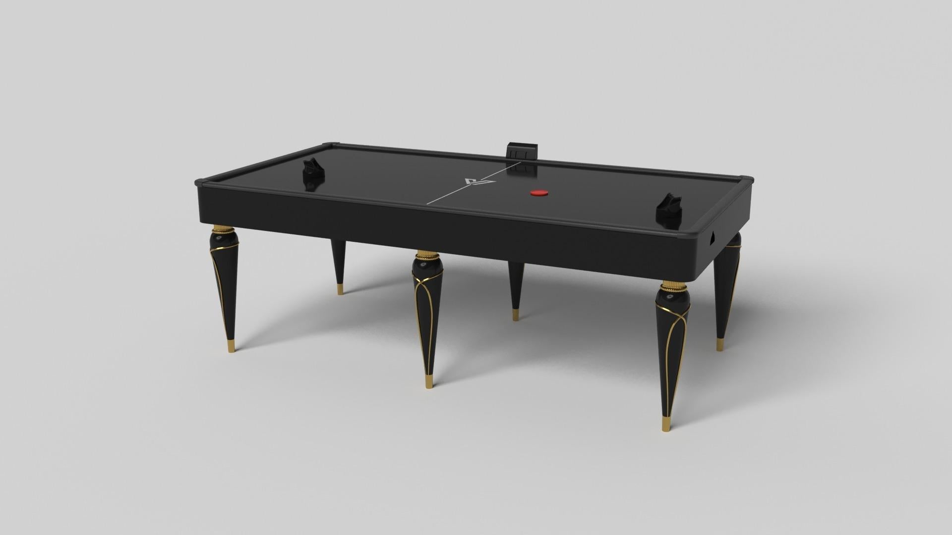 Champagne gold accents add undeniable elegance to this luxury air hockey table. Offering superior playability and uncompromised style, this design features hand carved details, decorative metal elements, and metal sabots at the bottom of each leg.