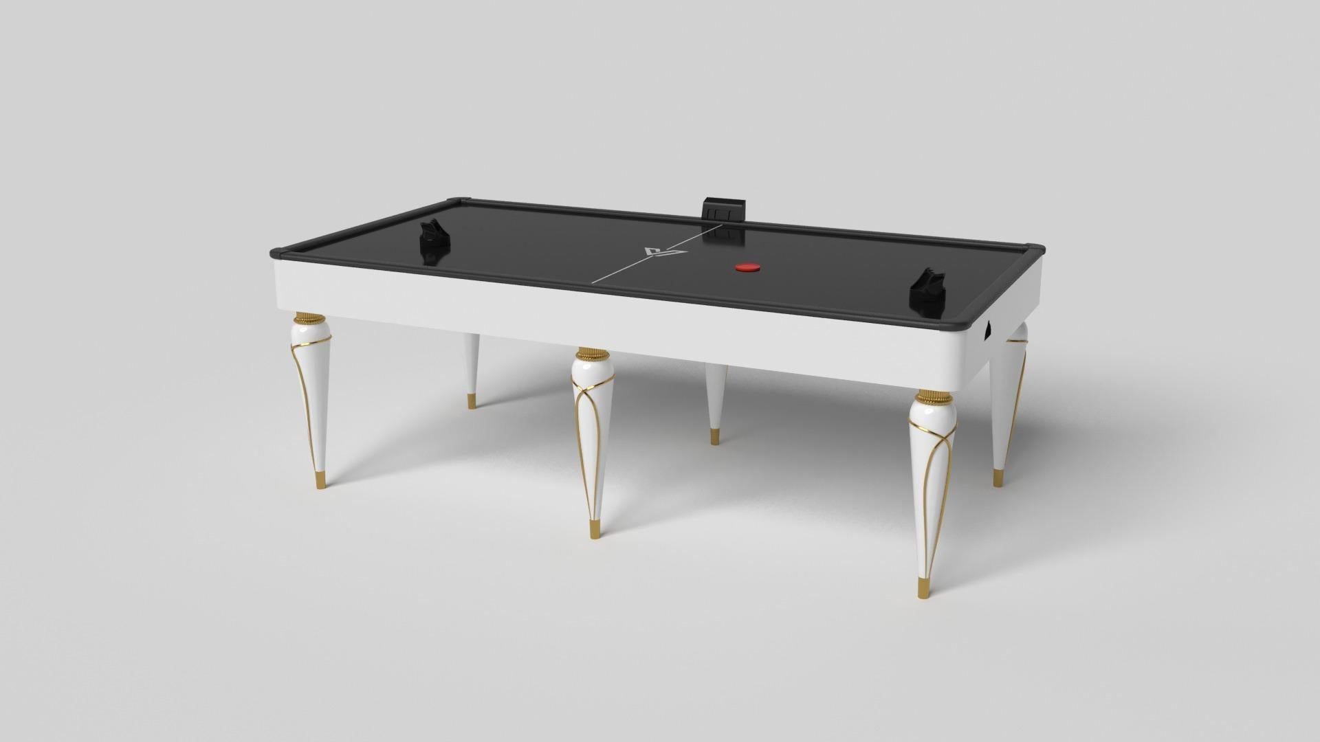 Champagne gold accents add undeniable elegance to this luxury air hockey table. Offering superior playability and uncompromised style, this design features hand carved details, decorative metal elements, and metal sabots at the bottom of each leg.