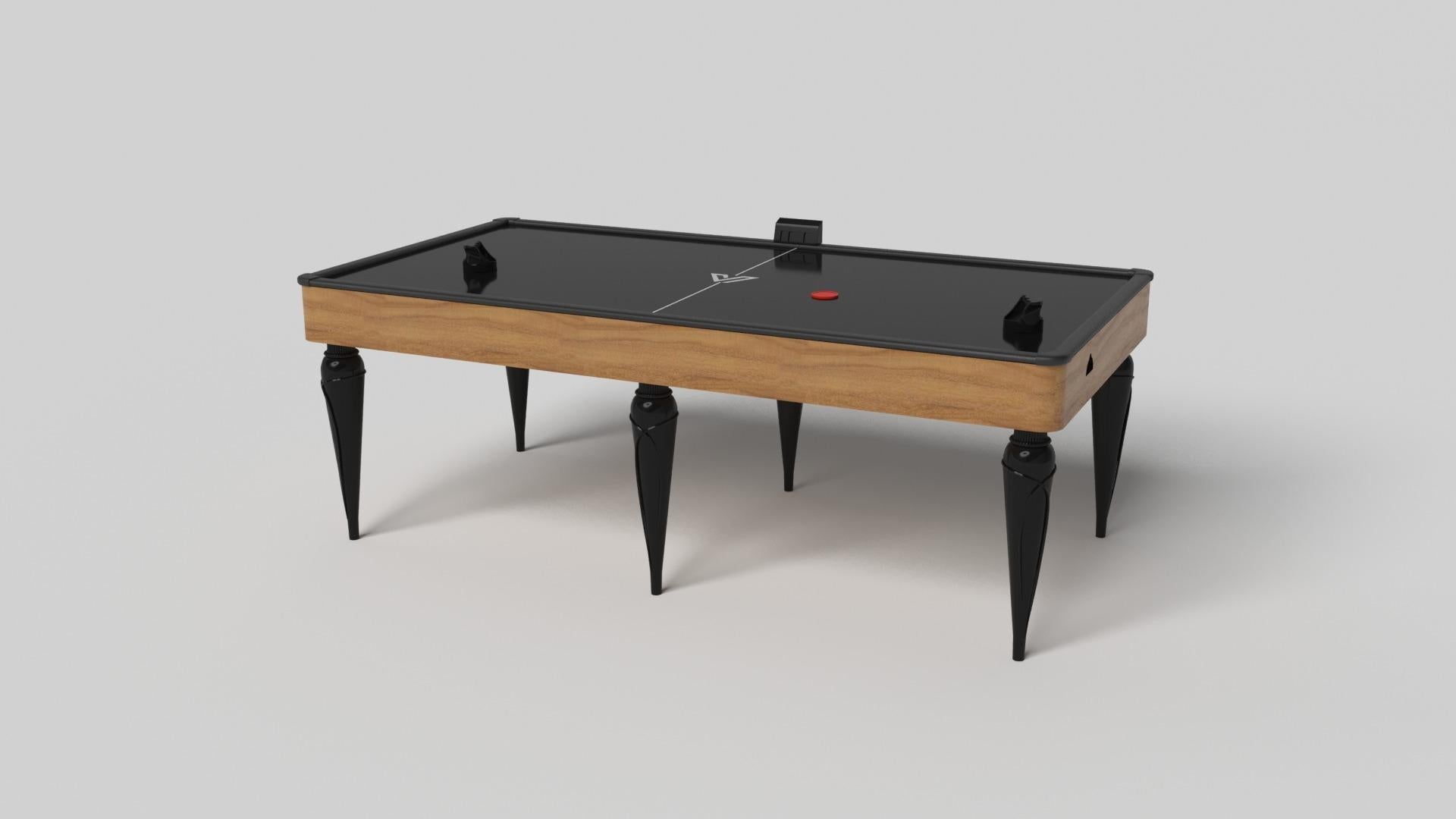 Los detalles en oro champán añaden una elegancia innegable a esta lujosa mesa de air hockey. Este diseño, que ofrece una jugabilidad superior y un estilo sin concesiones, presenta detalles tallados a mano, elementos metálicos decorativos y sabots