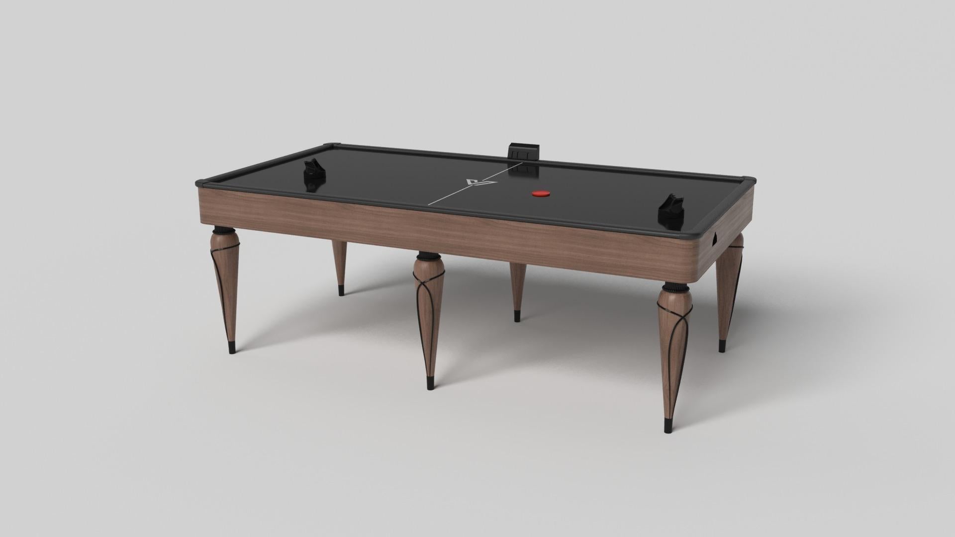Champagne gold accents add undeniable elegance to this luxury air hockey table. Offering superior playability and uncompromised style, this design features hand carved details, decorative metal elements, and metal sabots at the bottom of each leg.