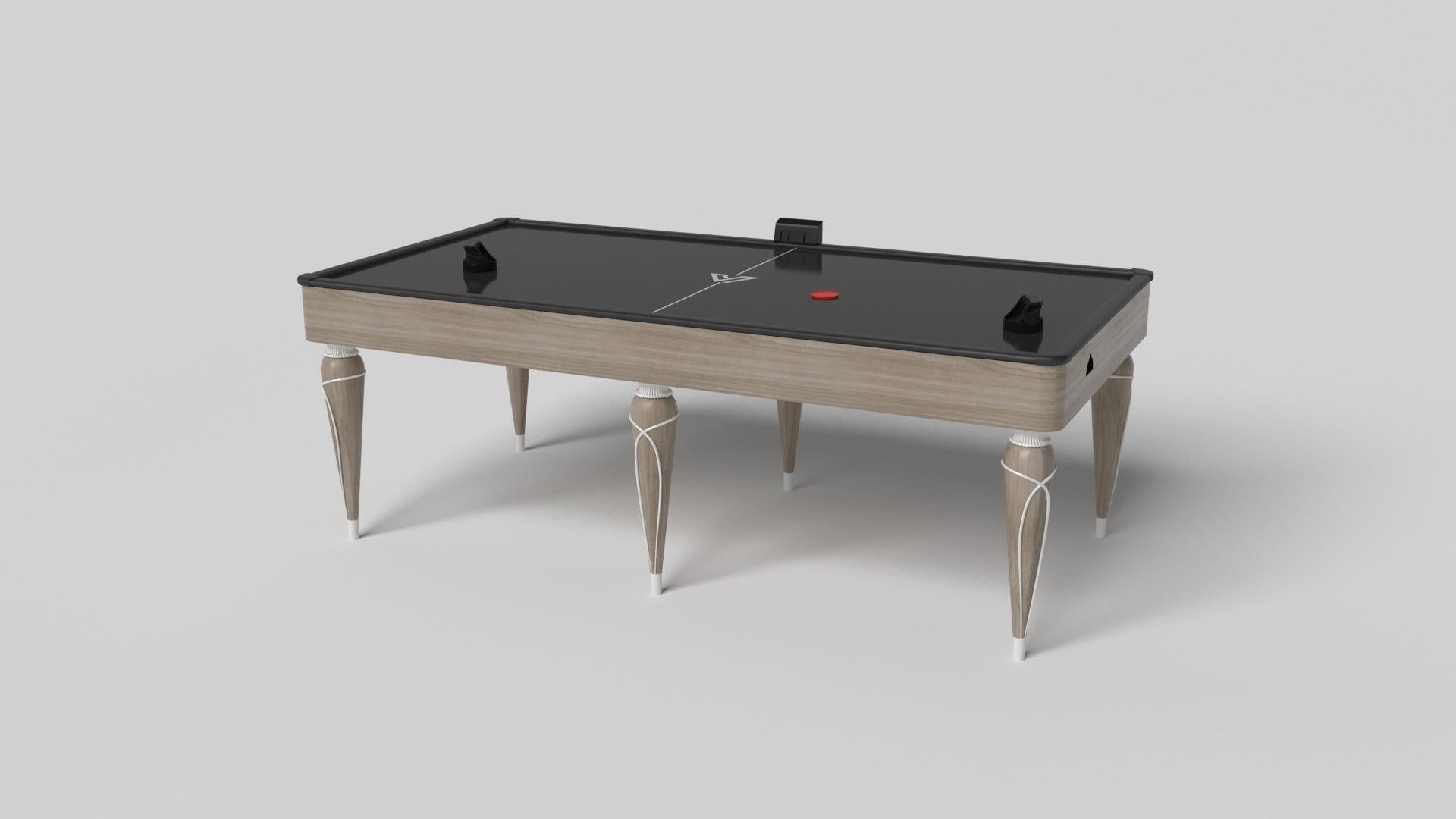 Los detalles en oro champán añaden una elegancia innegable a esta lujosa mesa de air hockey. Este diseño, que ofrece una jugabilidad superior y un estilo sin concesiones, presenta detalles tallados a mano, elementos metálicos decorativos y sabots