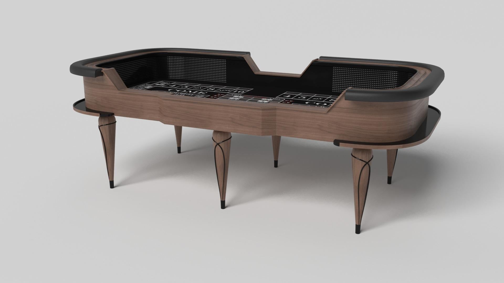 Champagne gold accents add undeniable elegance to this luxury craps table. Offering superior playability and uncompromised style, this design features hand carved details, decorative metal elements, and metal sabots at the bottom of each leg. The