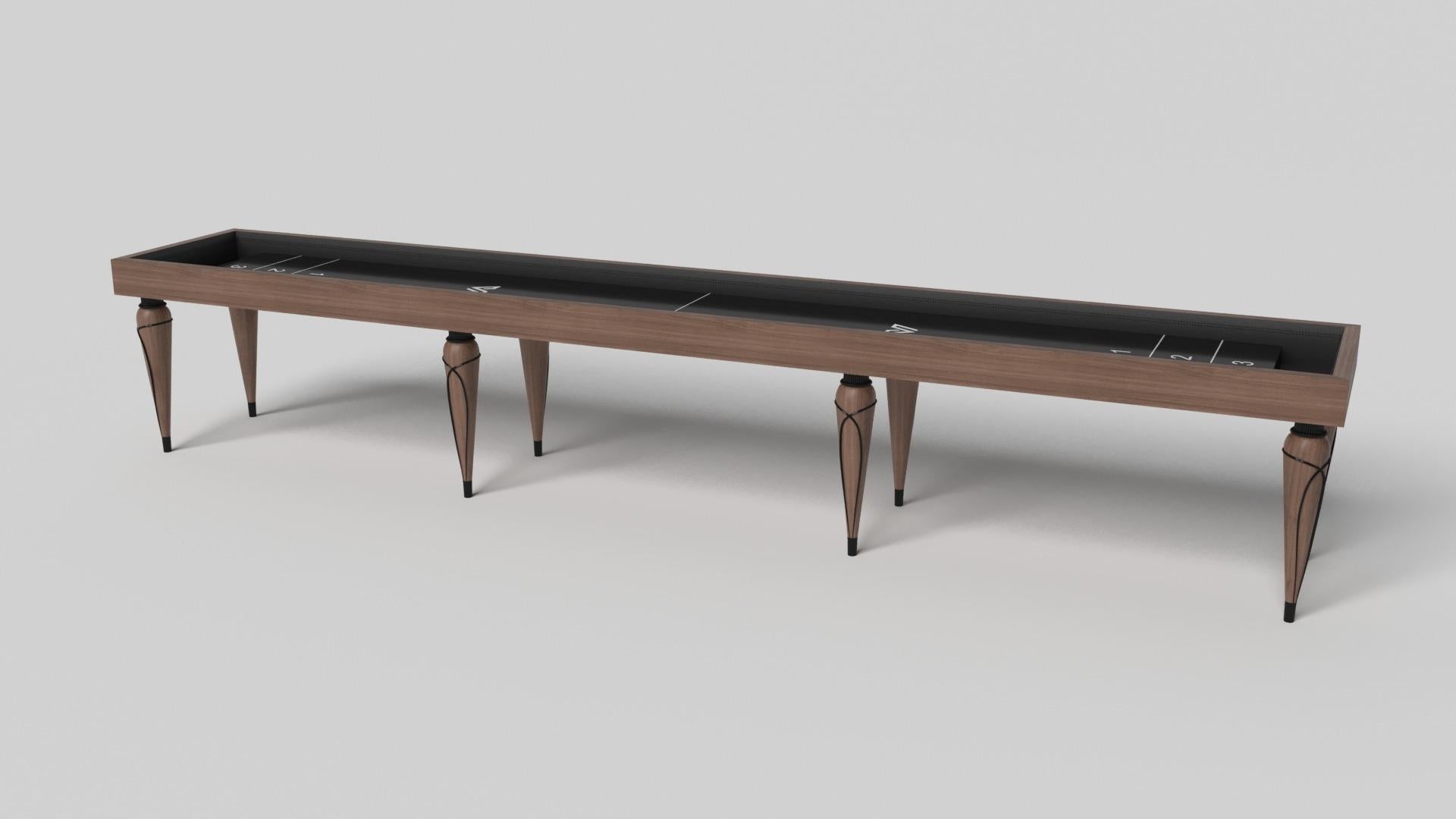Champagne gold accents add undeniable elegance to this luxury shuffleboard table. Offering superior playability and uncompromised style, this design features hand carved details, decorative metal elements, and metal sabots at the bottom of each leg.