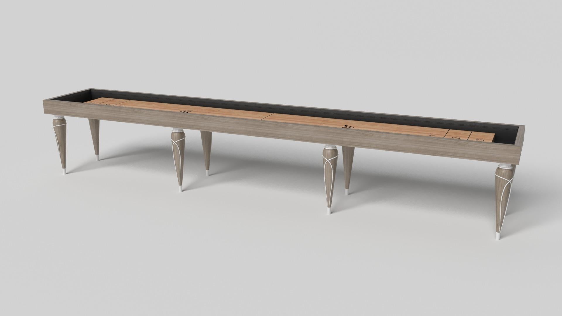 Champagne gold accents add undeniable elegance to this luxury shuffleboard table. Offering superior playability and uncompromised style, this design features hand carved details, decorative metal elements, and metal sabots at the bottom of each leg.